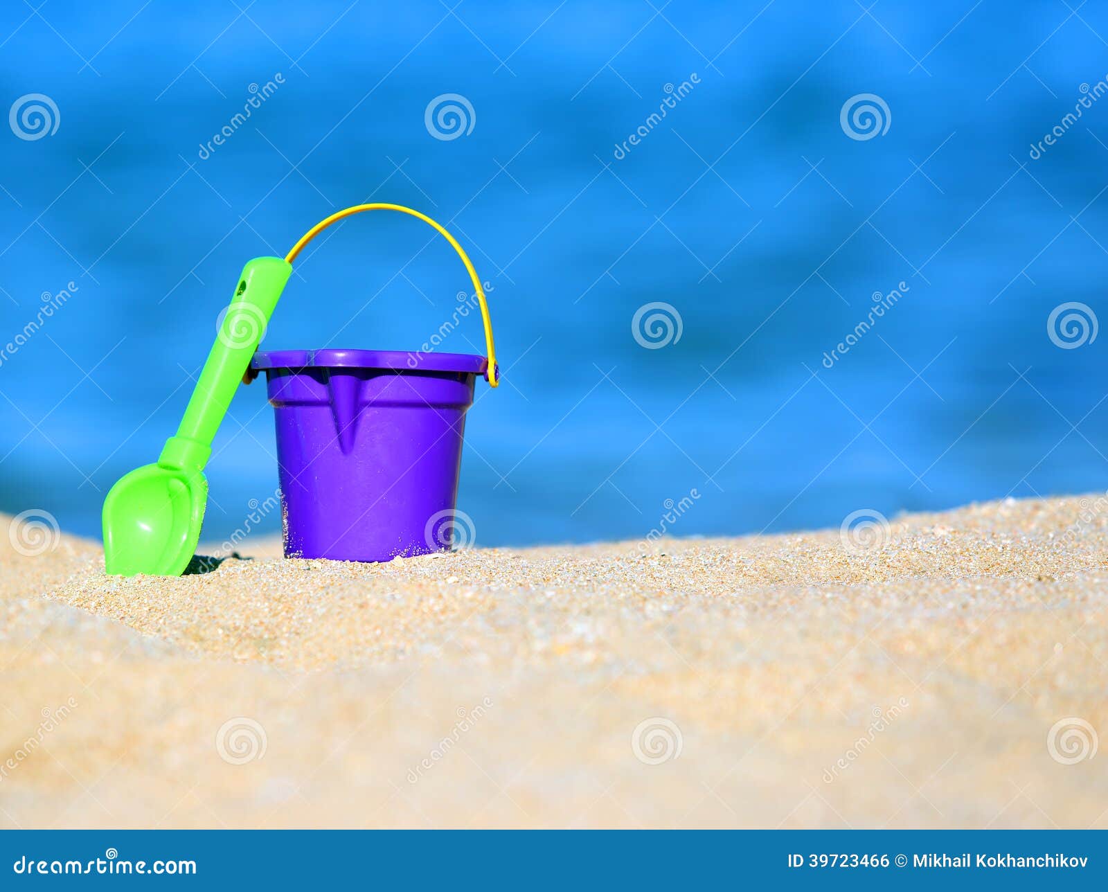 Bucket and Shovel in Sand on Seashore Stock Photo - Image of bright ...