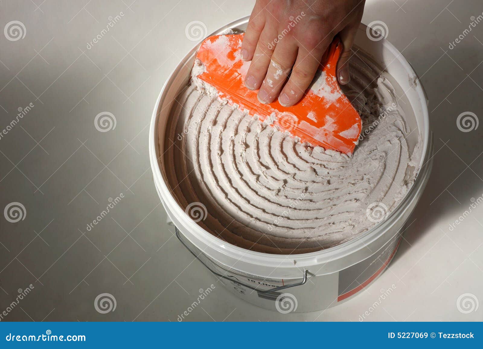 Bucket of tile adhesive stock image. Image of interior 5227069