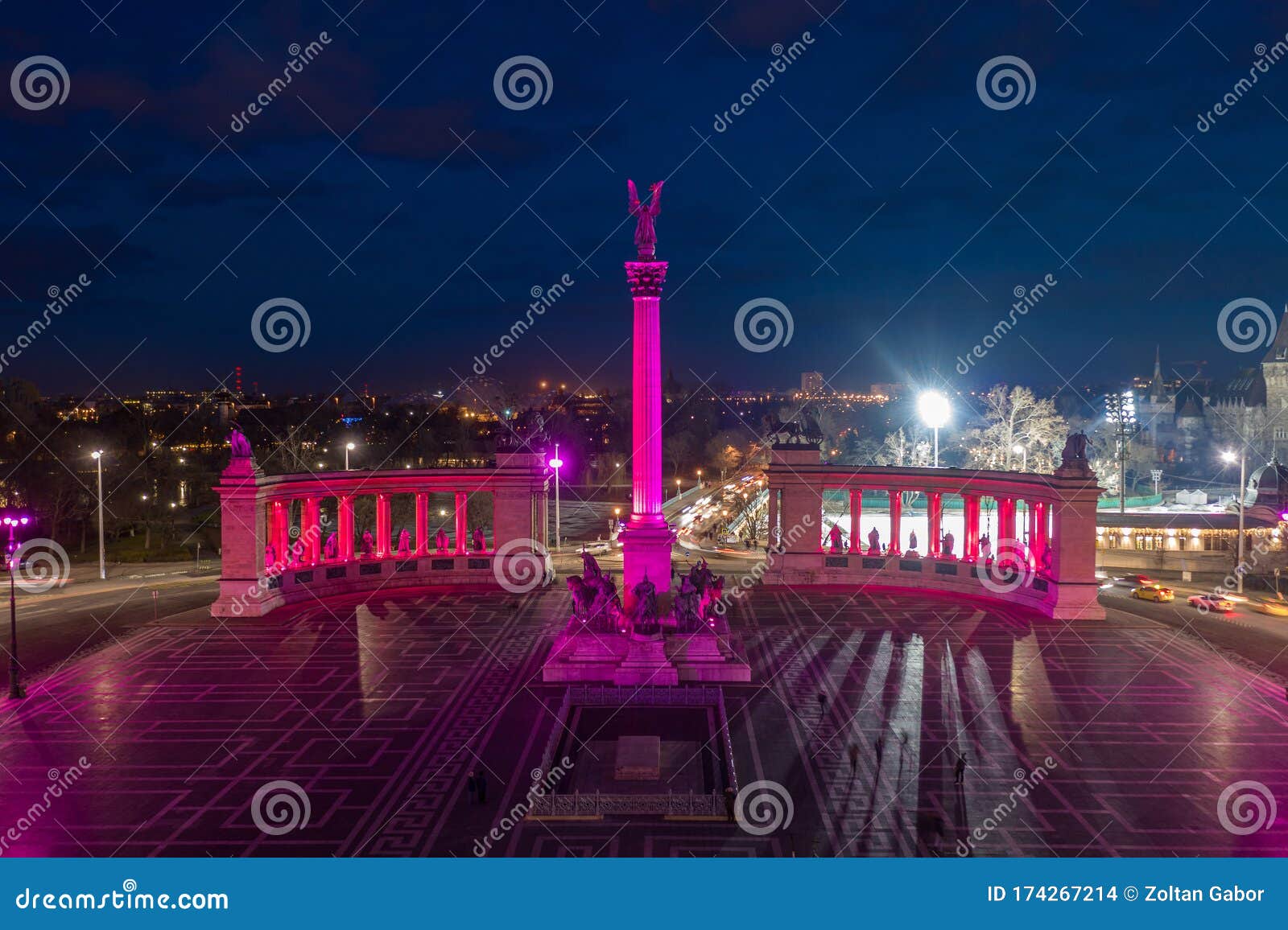 budapest, hungary - aerial drone view of the famous heroes` square hosok tere lit up in unique purple and pink lights by night
