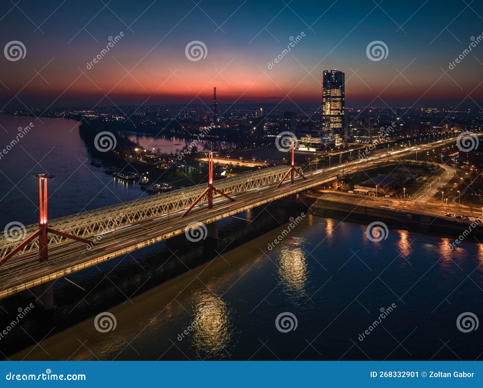 budapest, hungary - aerial view of rakoczi bridge above river danube with traffic lights and mol campus skyscraper building