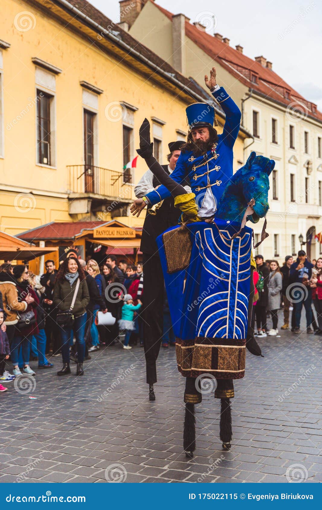 BUDAPEST MARCH 15 Performance of Artists on Stilts on a Street in