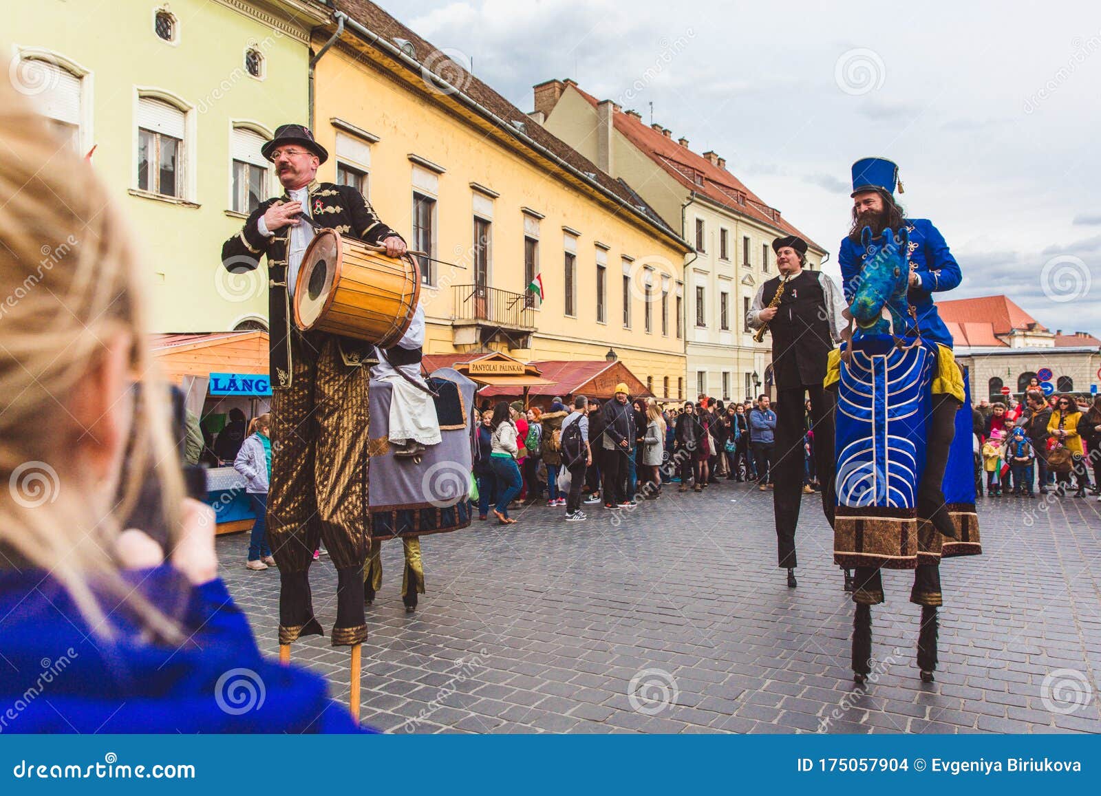 BUDAPEST MARCH 15 Performance of Artists on Stilts on a Street in