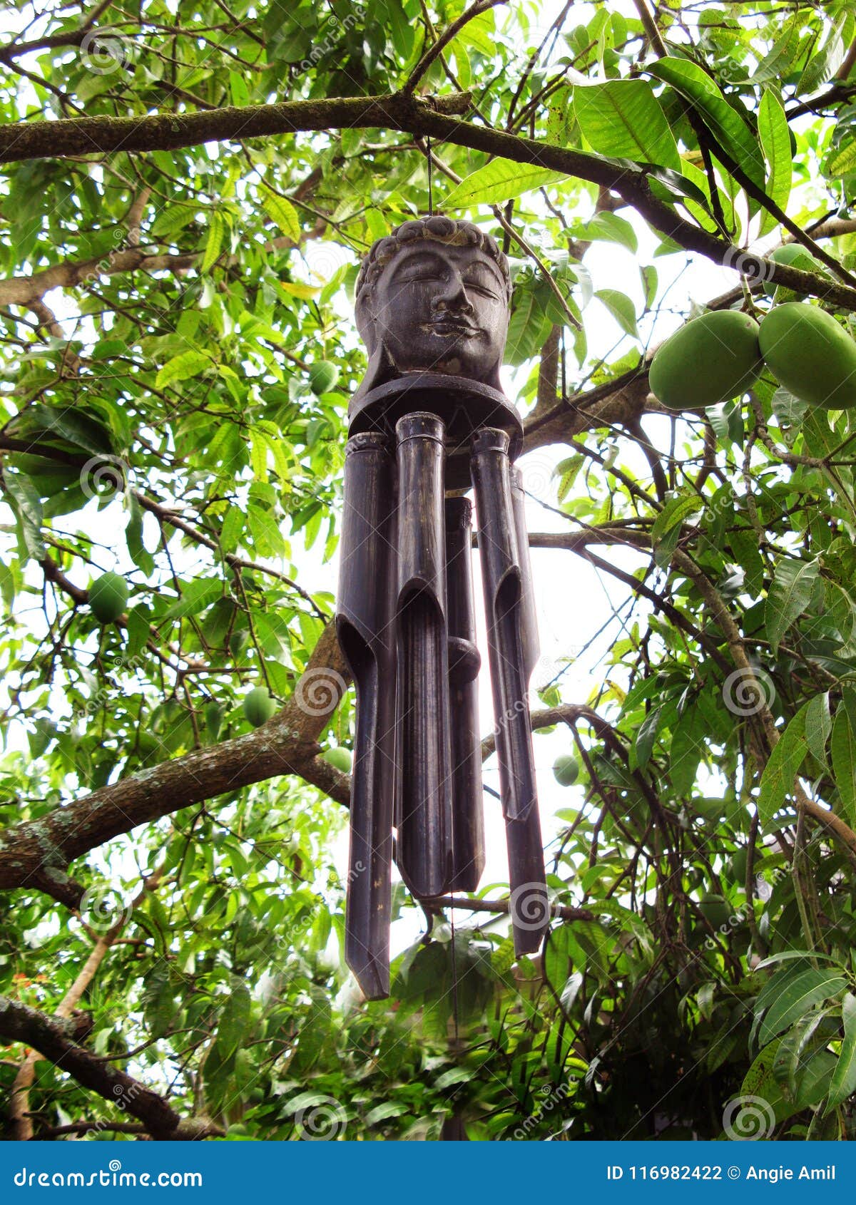Buddha Face Wood Chimes stock photo. Image of buddha 116982422