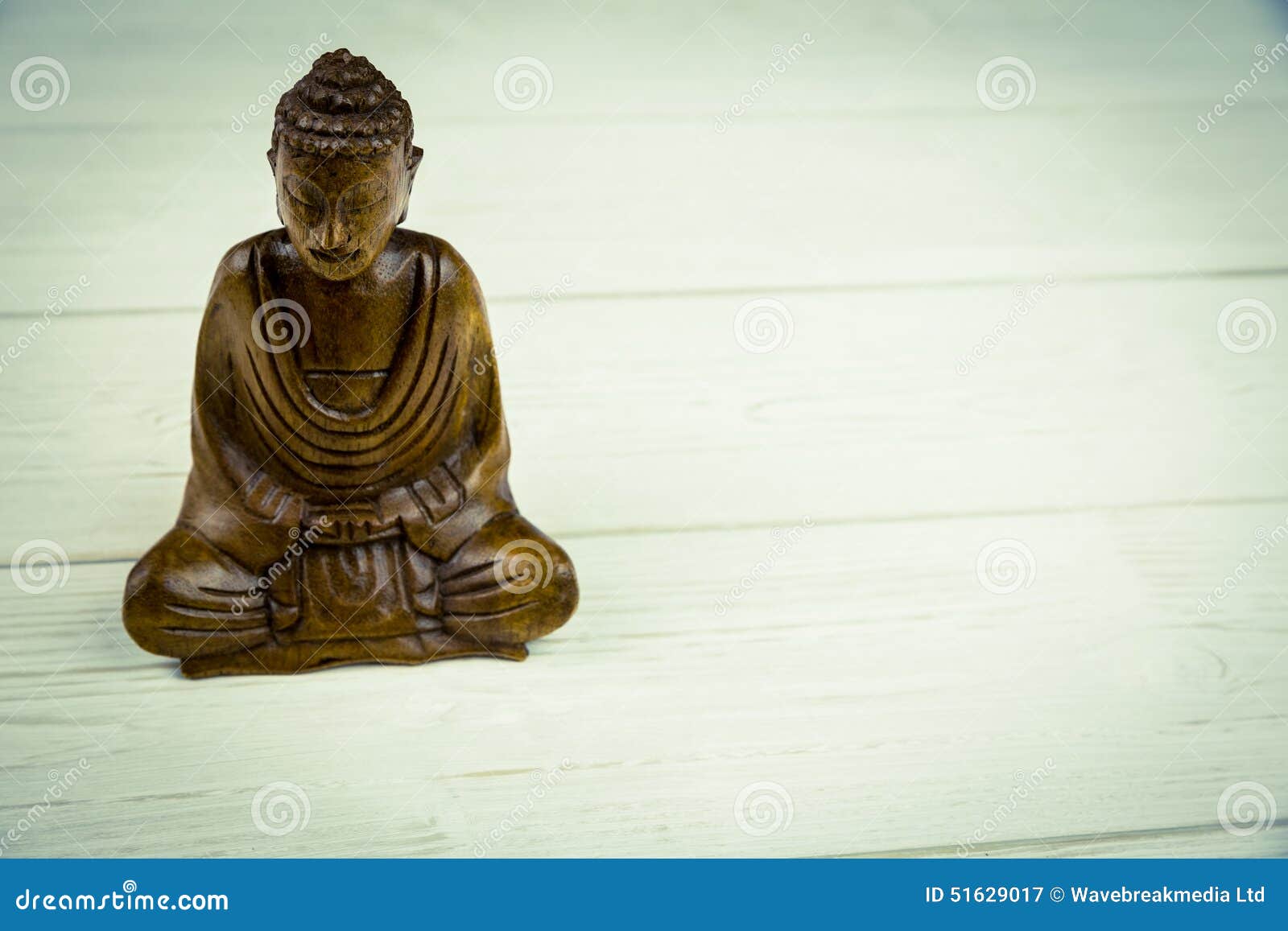 Buddha statue on a table stock image. Image of peace 51629017