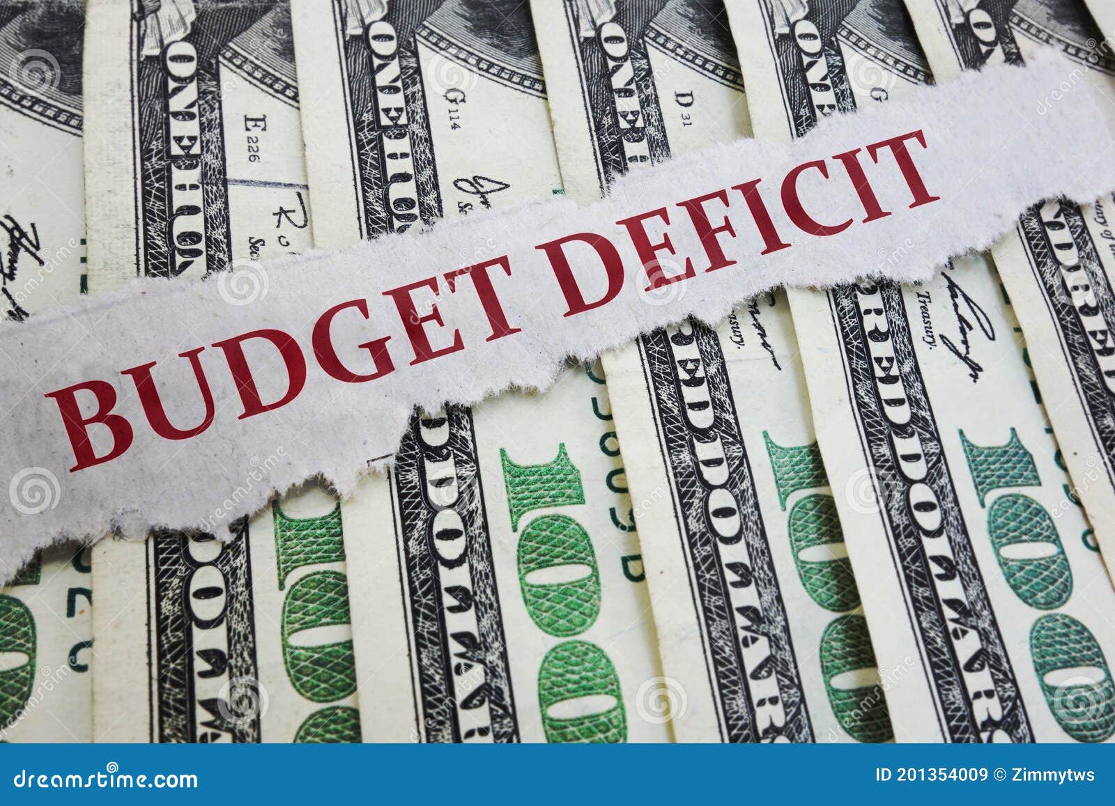 budget deficit newspaper headline on money