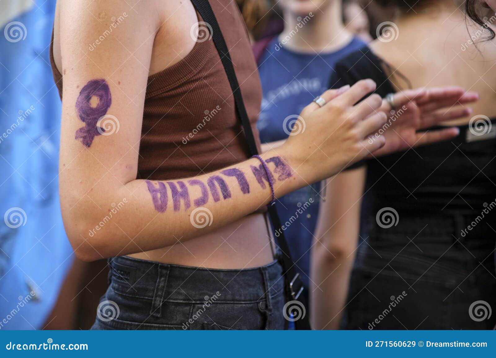 Portrait Of Pretty Feminist Woman Shows Her Muscular Arms Proud
