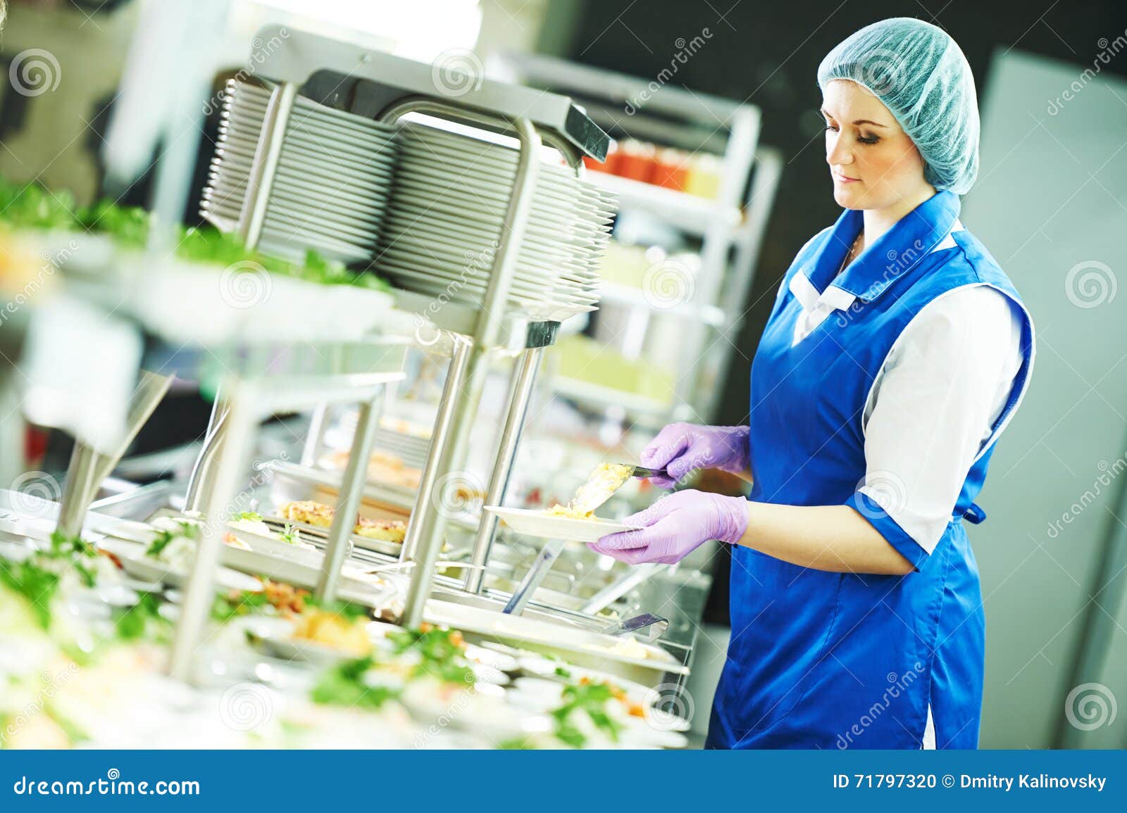 buffet female worker servicing food in cafeteria