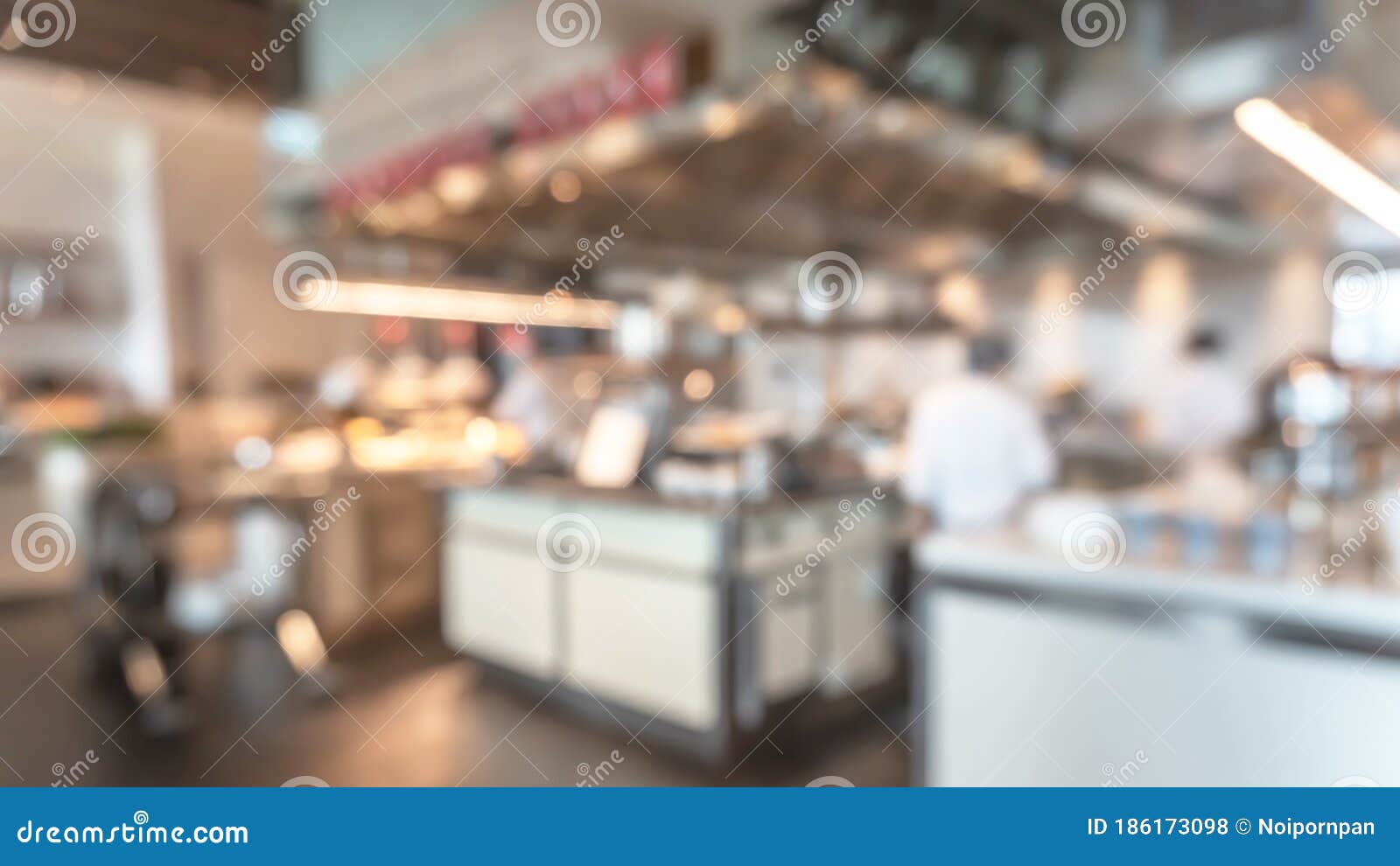 buffet at hotel restaurant interior blur background with blurry open kitchen counter bar of food catering service business