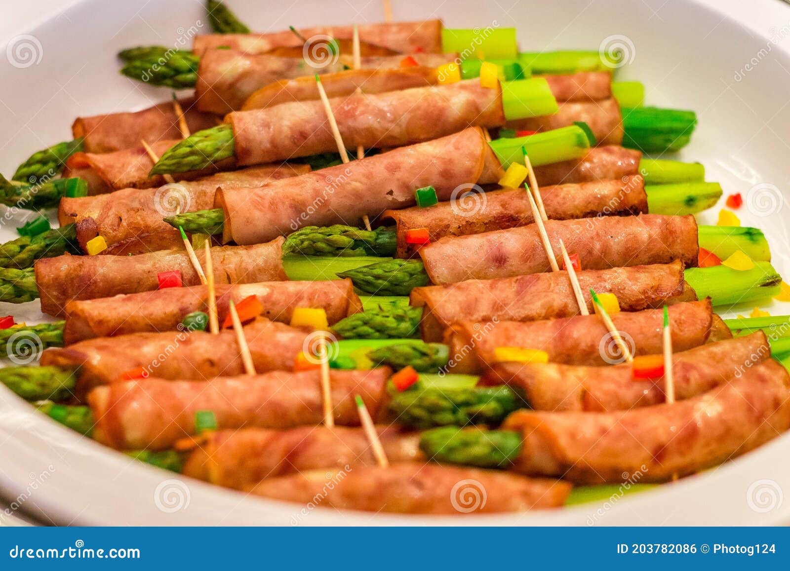 A Buffet Offering of Asparagus Wrapped in Ham and Skwered with a