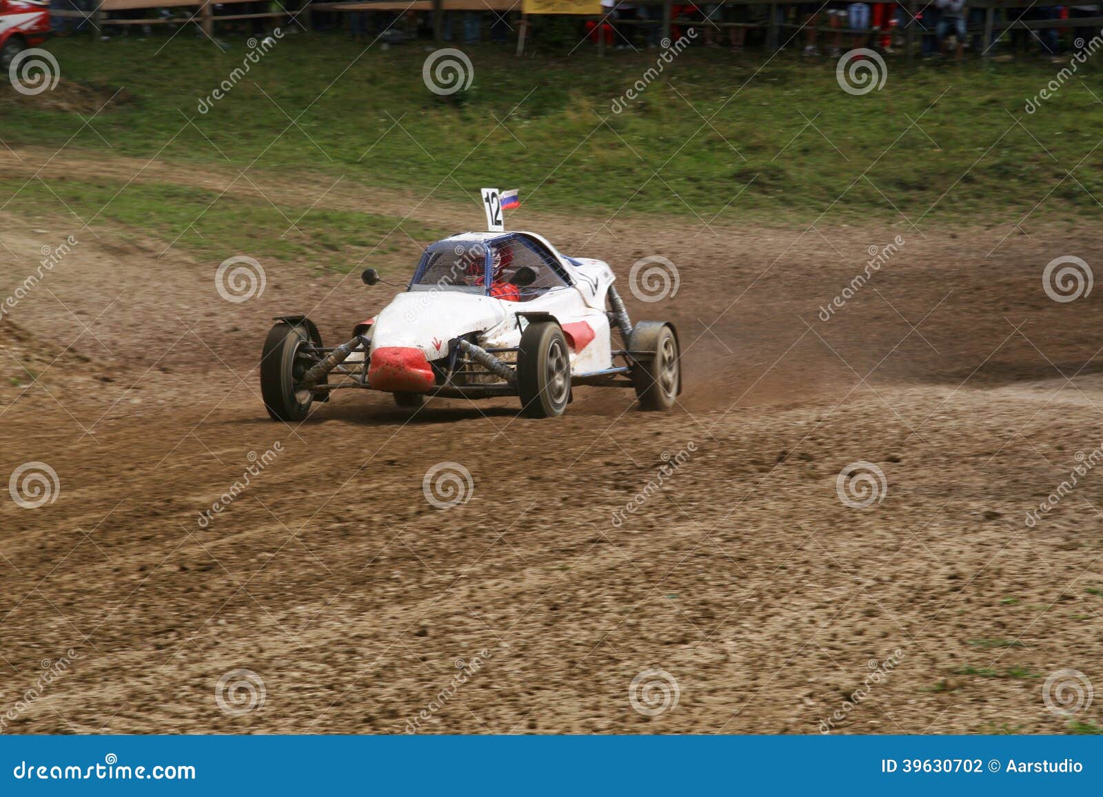 Buggy on Track Going Fast and Throwing Dirt in the Air Stock Photo