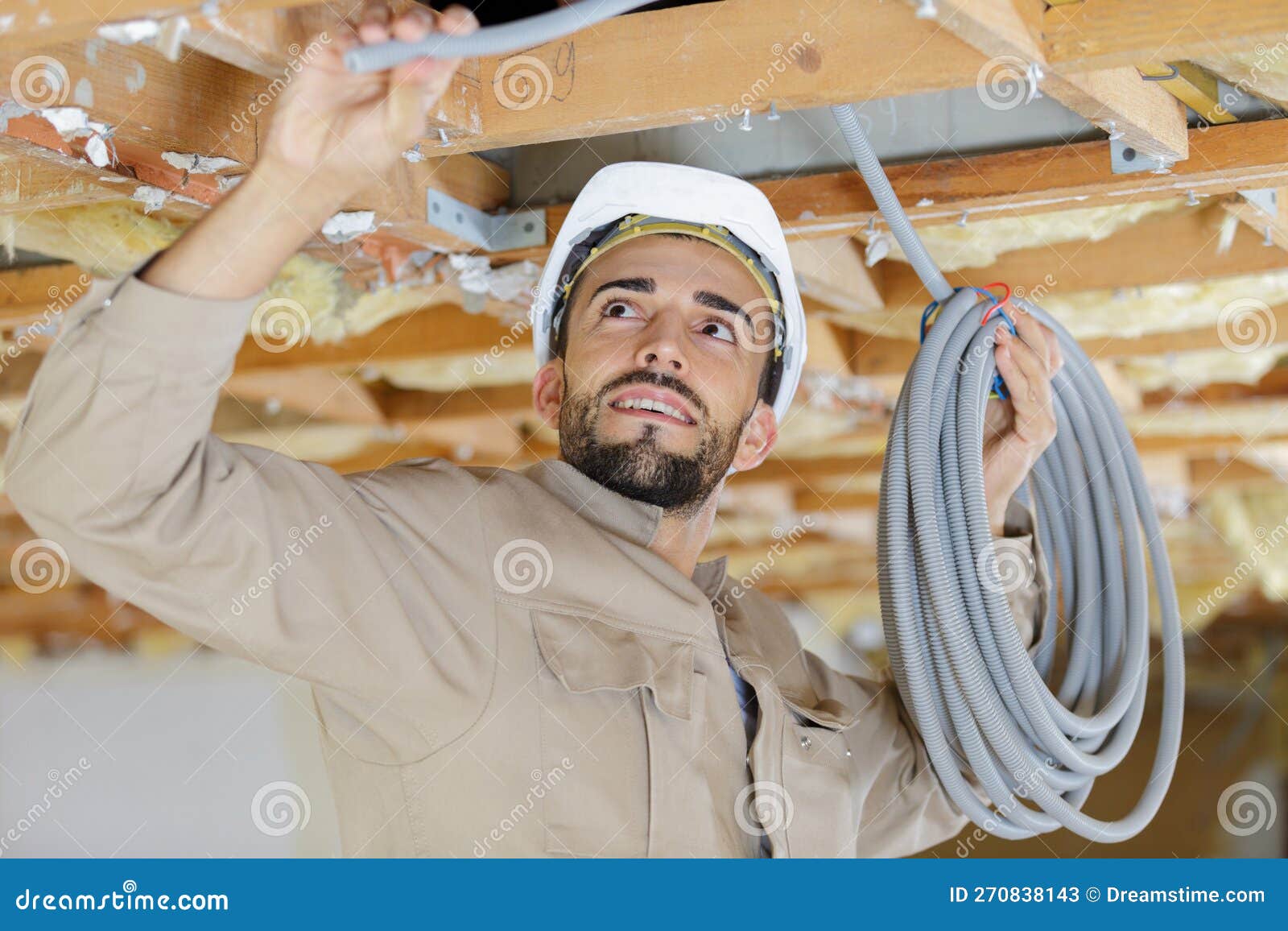 Builder Attaching Cables in Ceiling Stock Image Image of conduit