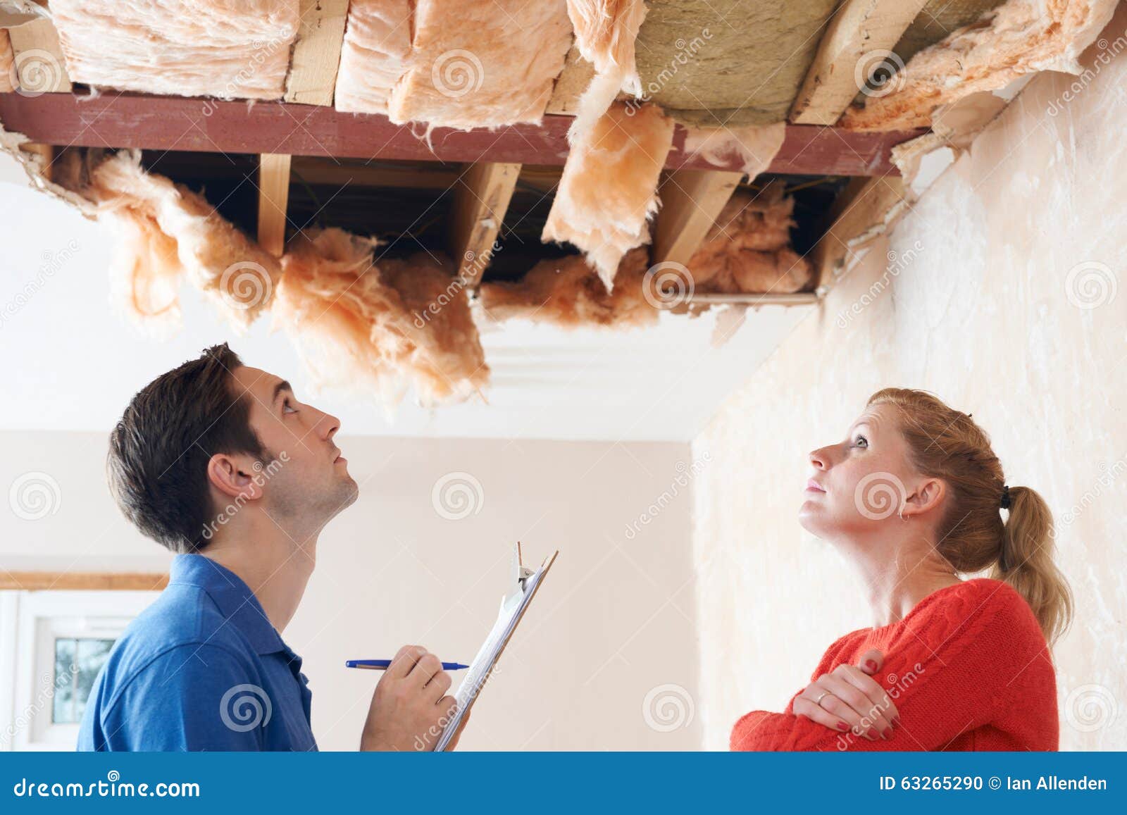 builder and client inspecting roof damage