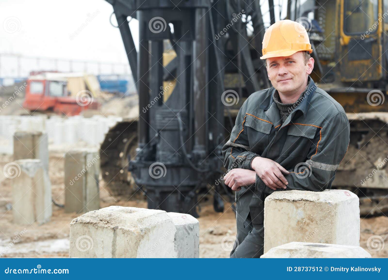 builder in dirty workwear at construction site