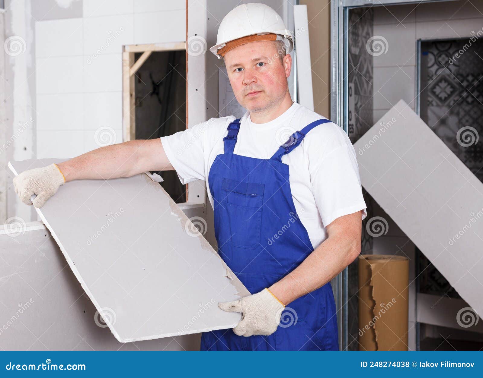 Builder Engaged in Drywall Installation Stock Photo Image of