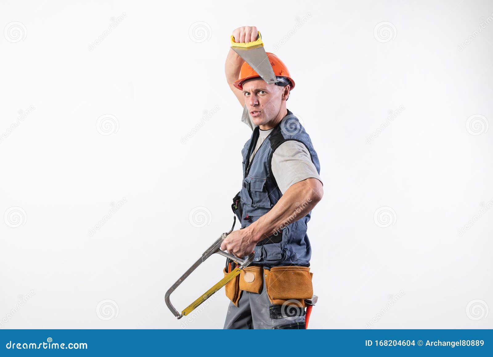 a builder with hacksaws in a helmet mocks. on a light background