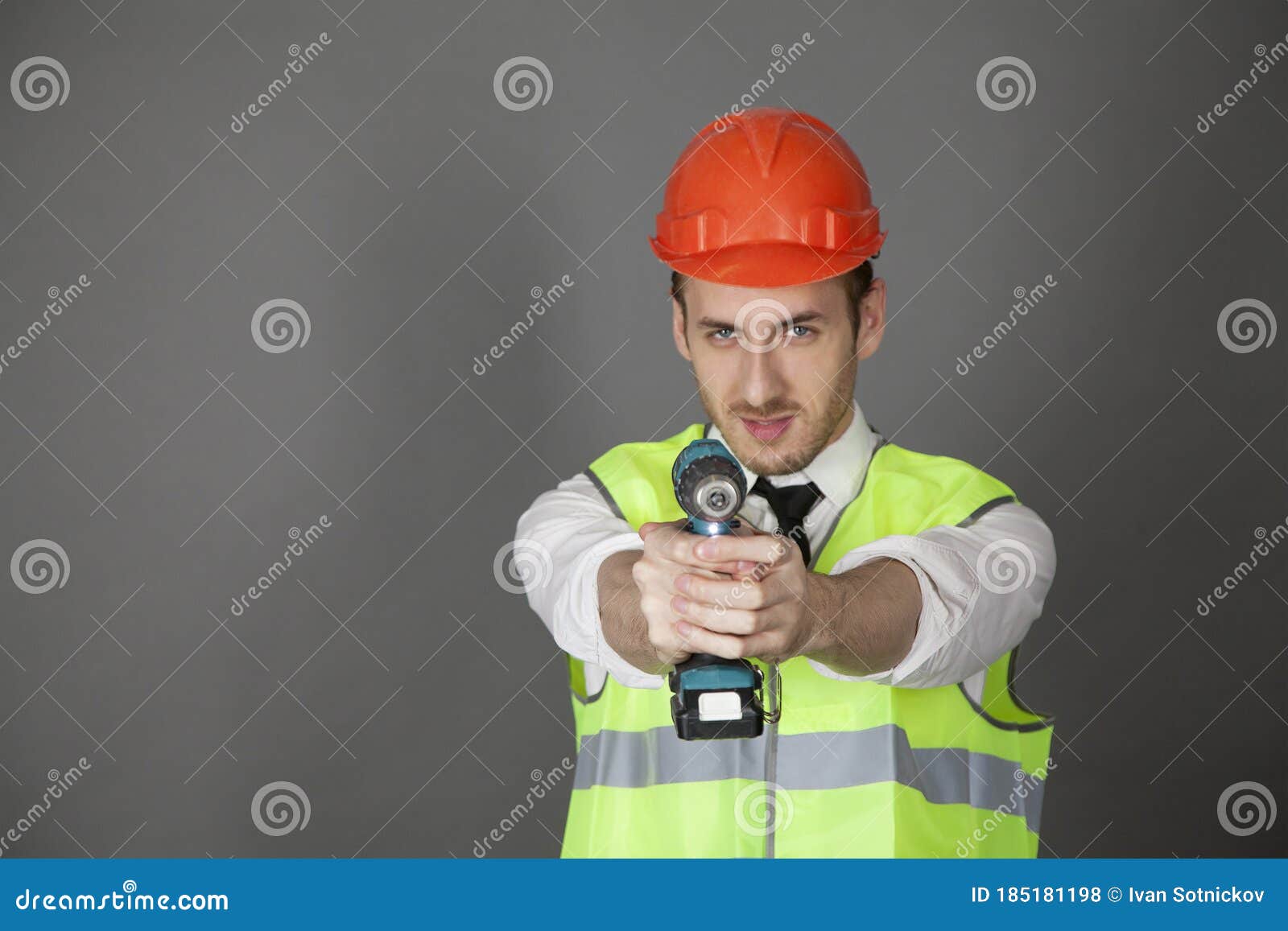 Builder Holds the Screwdriver As a Weapon Stock Photo Image of smile