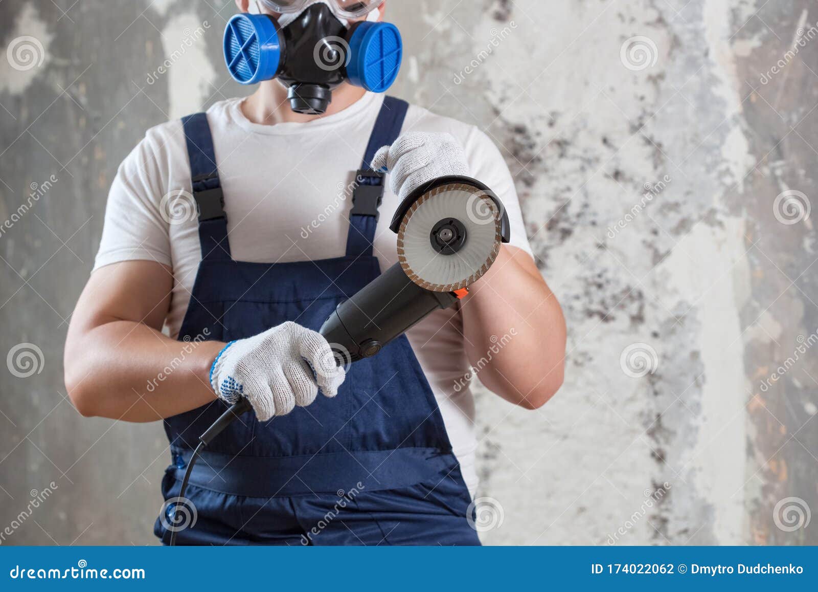 The Builder Holds in Hands Angle Grinder. Repair Work, Interior