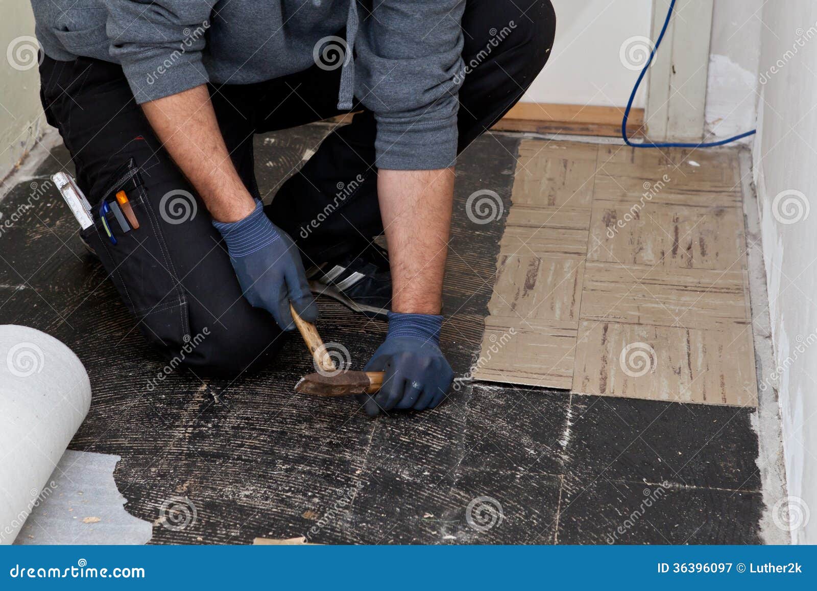 Builder Lifting Old Floor Tiles In A Passage Stock Image Image