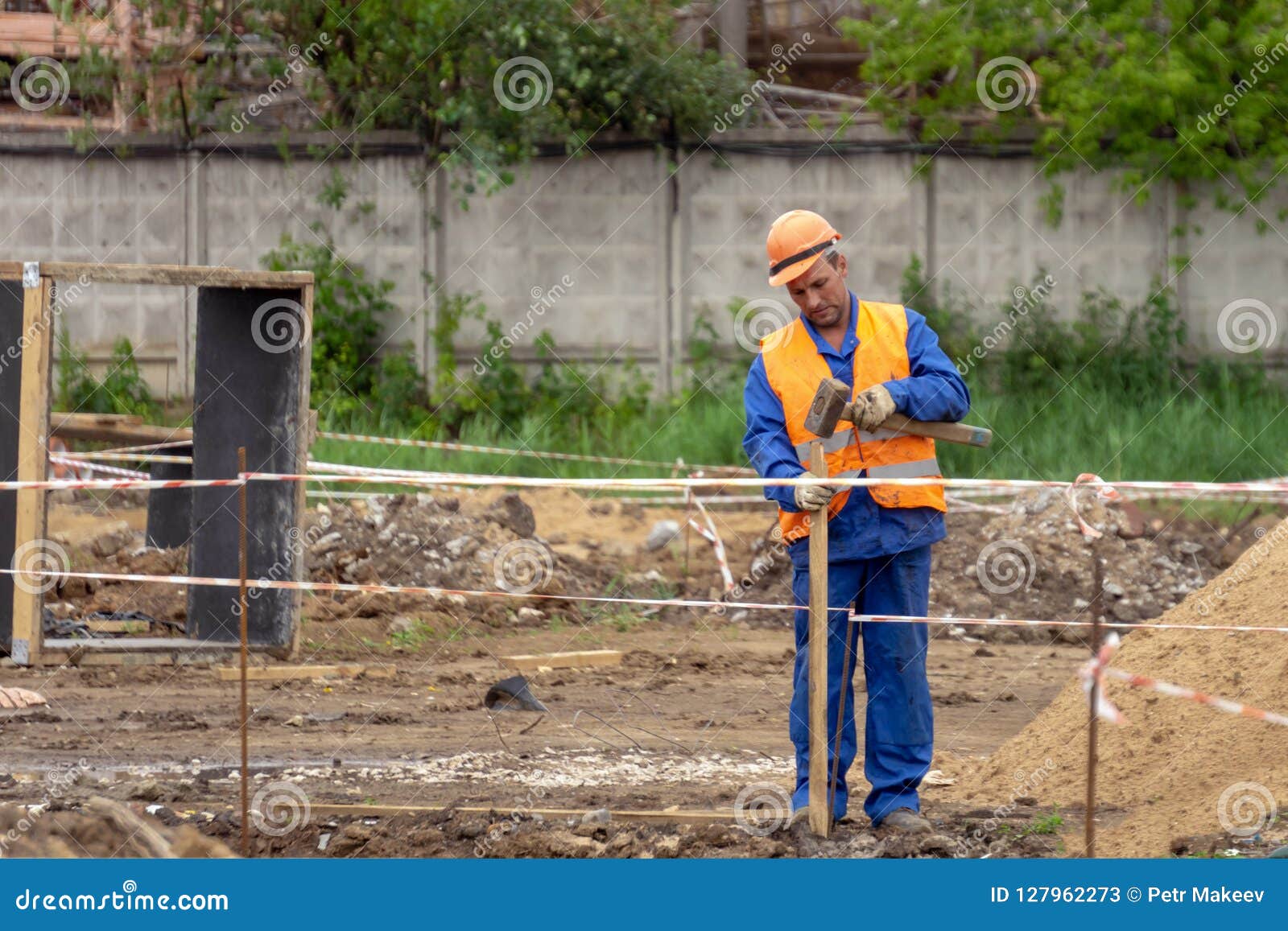 Builder Makes a Fence at the Construction Site Editorial Stock Photo Image of site, buildings