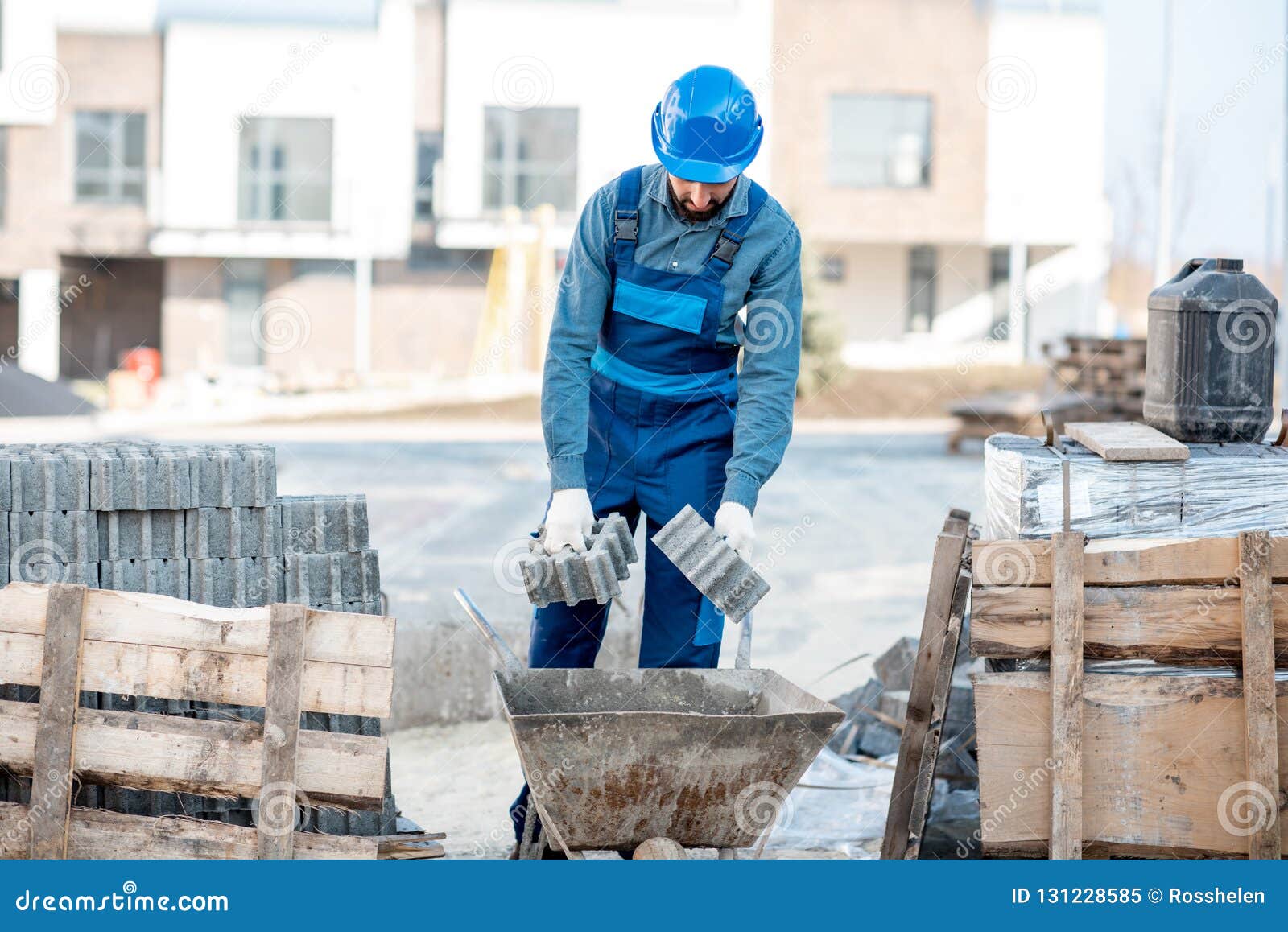Builder with Paving Tiles on the Construction Site Stock Image Image