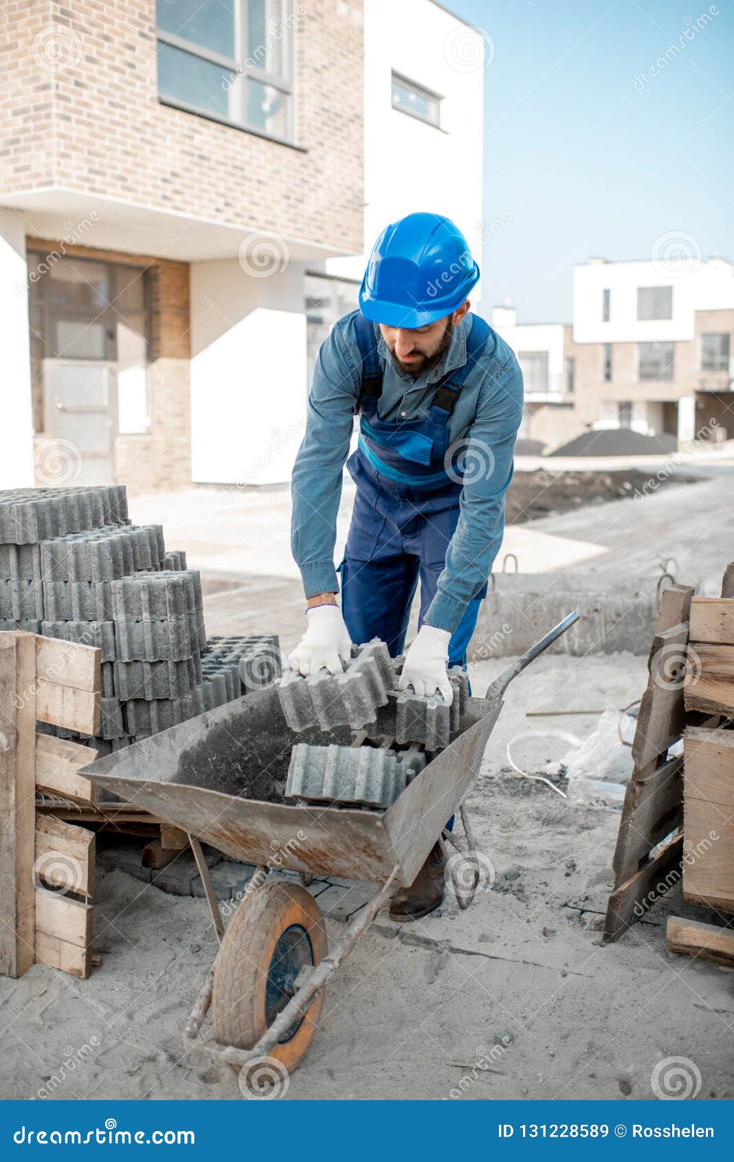 Builder with Paving Tiles on the Construction Site Stock Image Image