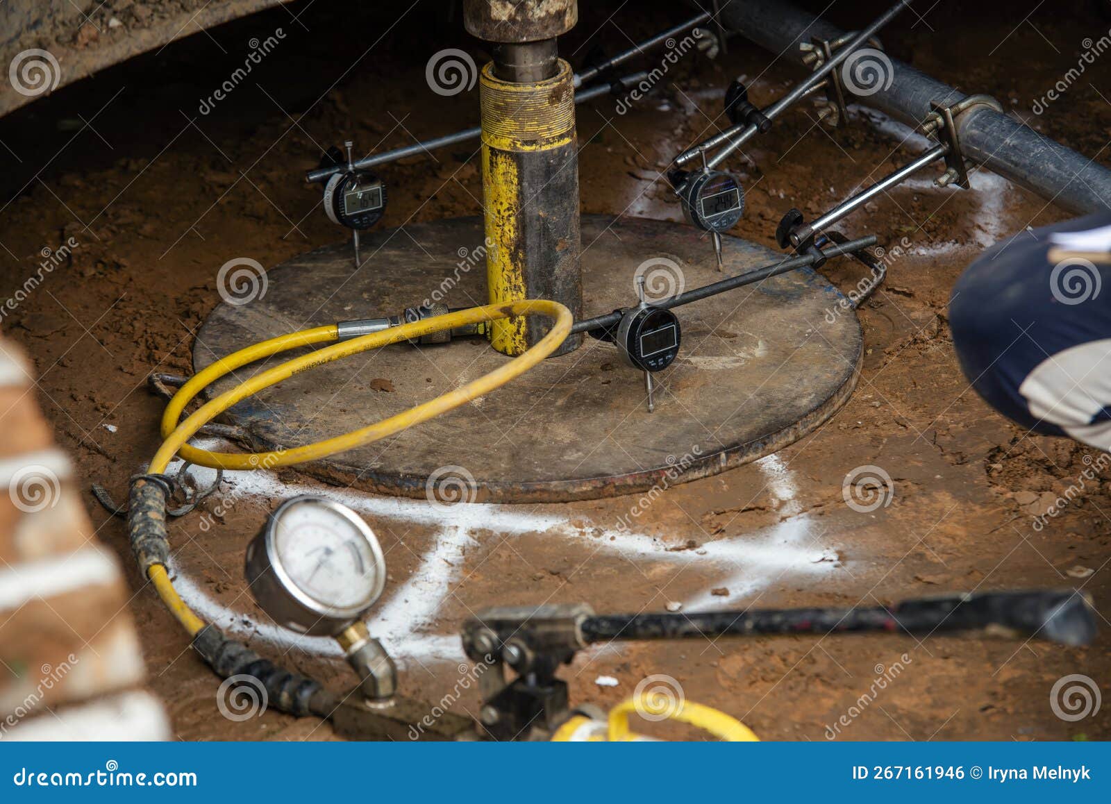 Builder Performing Ground Bearing Capacities Test on Building Site