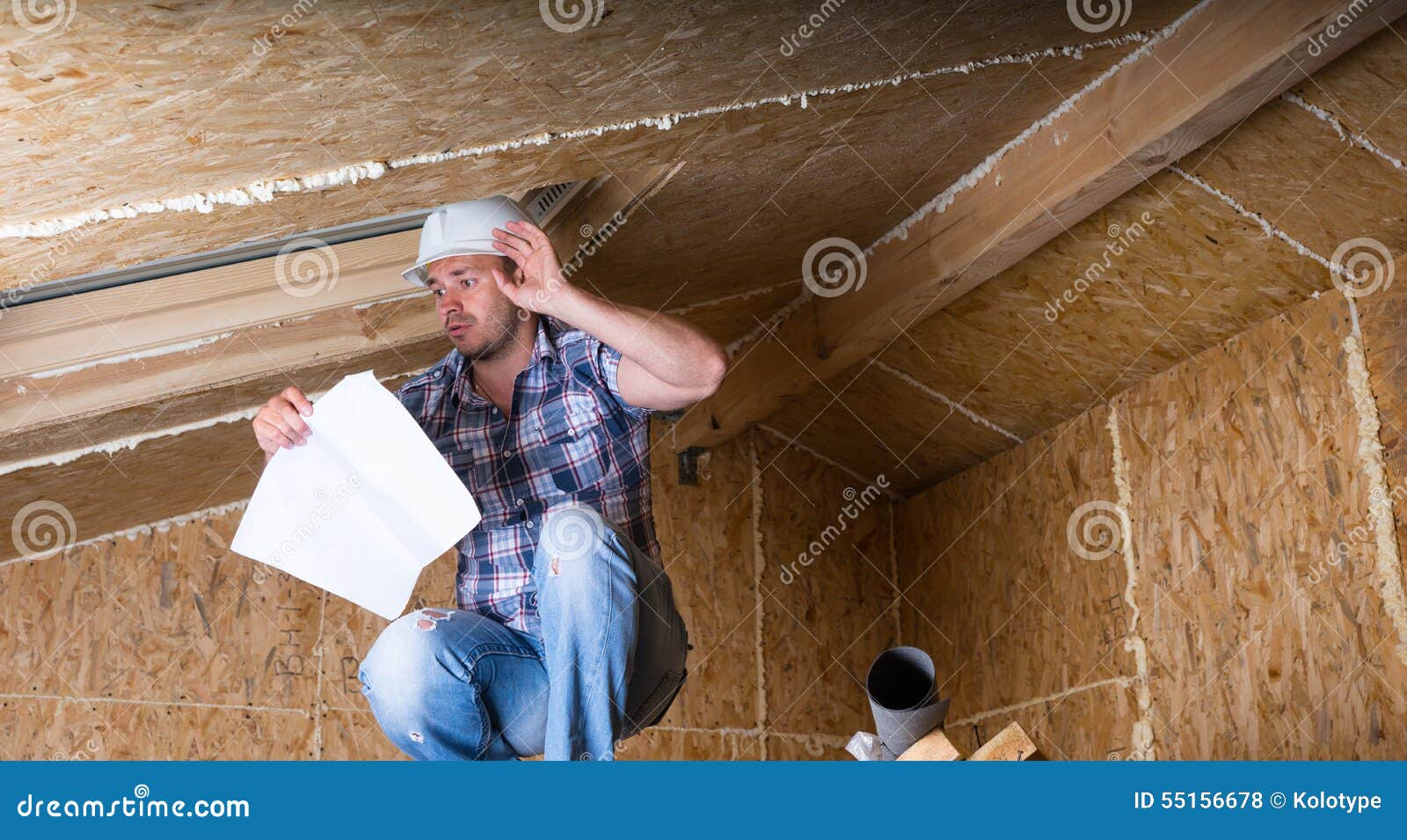 Builder Reading Plans Inside Unfinished Home Stock Photo Image of