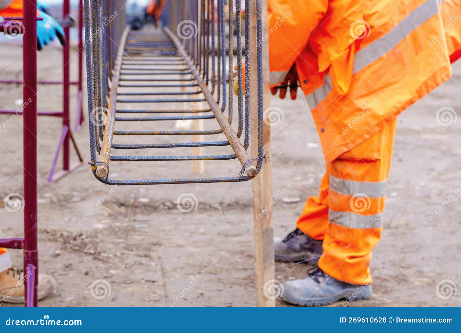 Builder S Hands Fixing Steel Reinforcement Bars at Construction Site