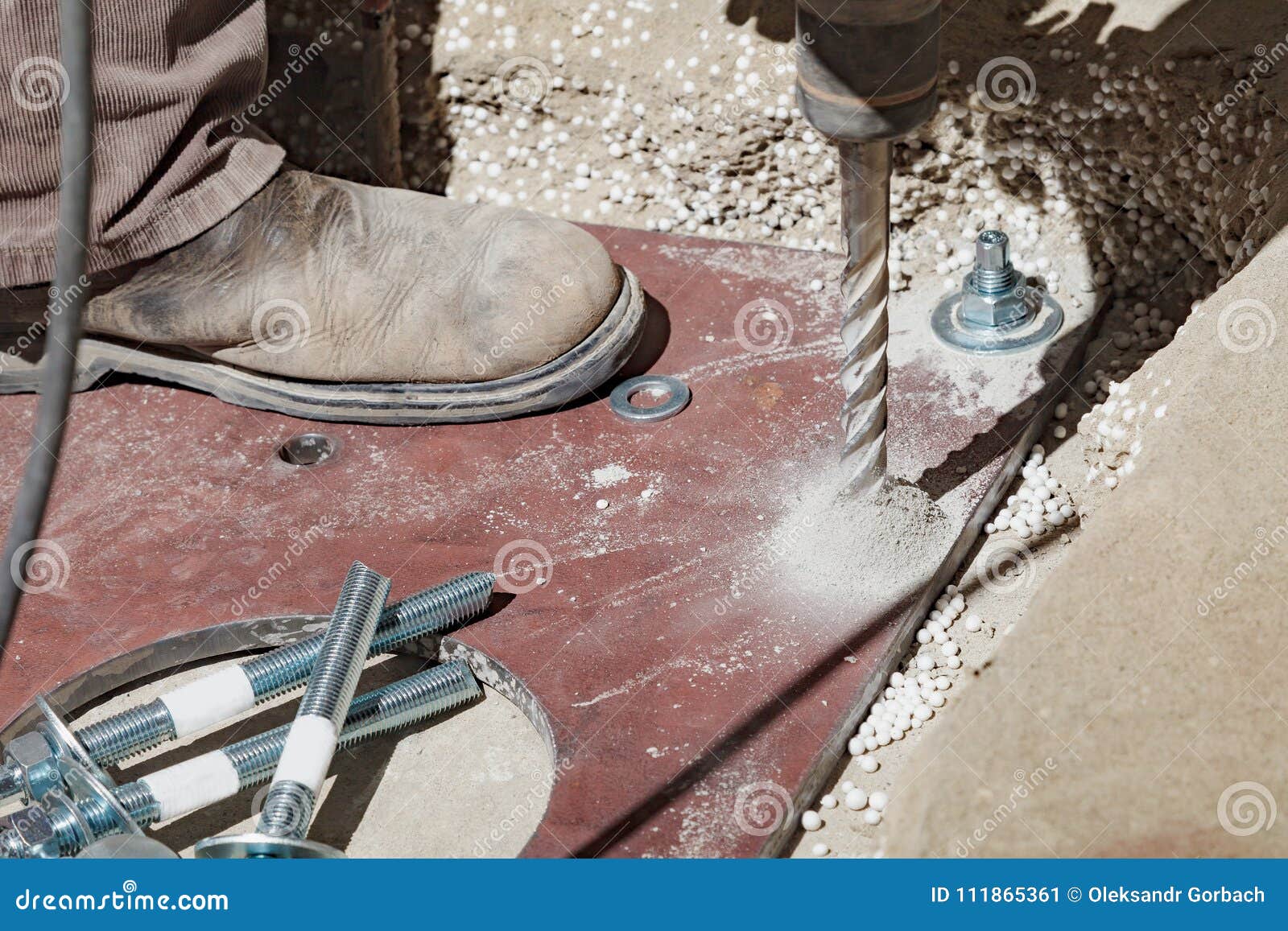 The Builder Uses A Drill To Make Holes In A Concrete Stock Image