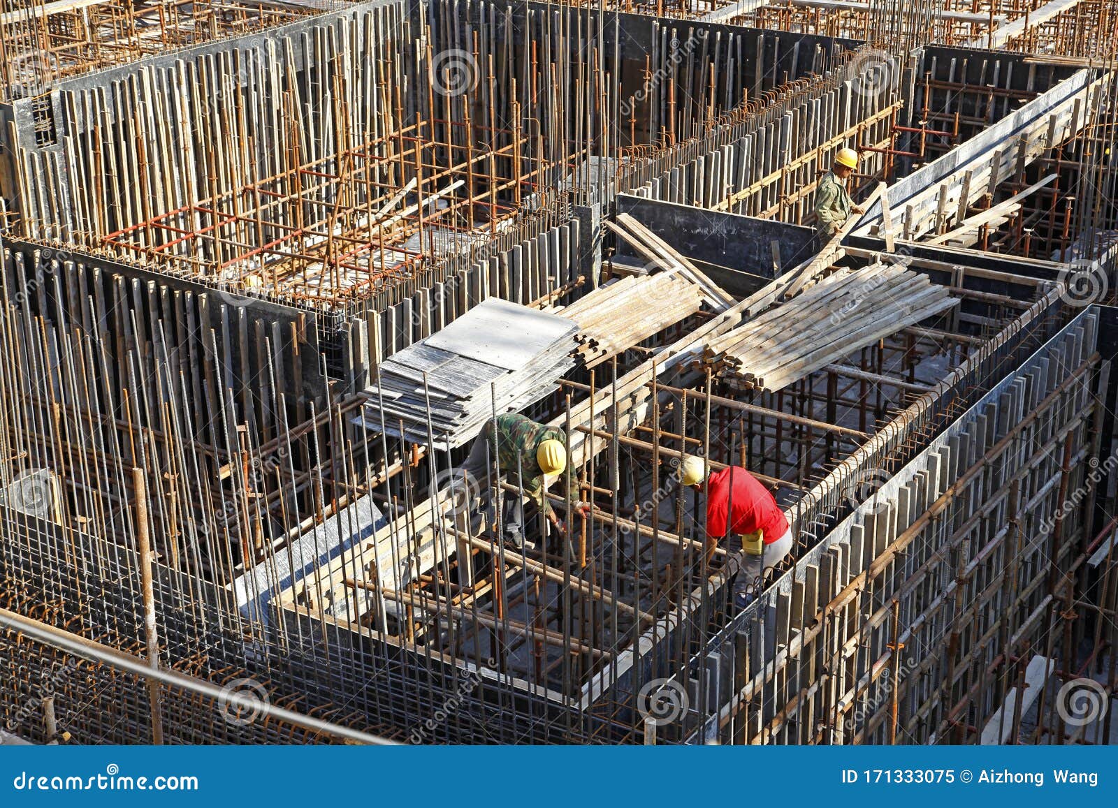 Builder Worker Knitting Metal Rods Bars into Framework Reinforcement