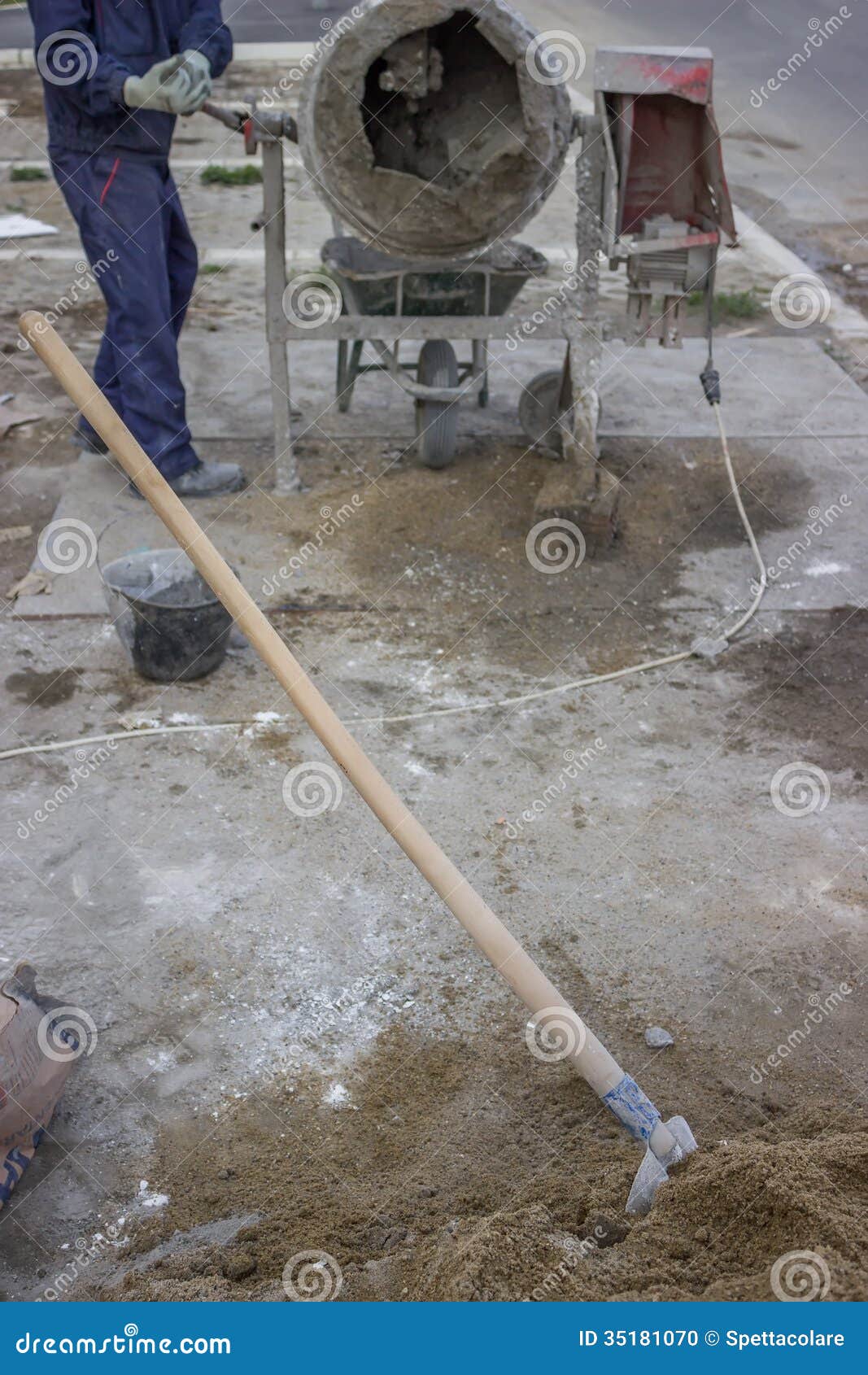 Builder Worker Mixing Cement, Shovel in First Plan Stock Photo - Image