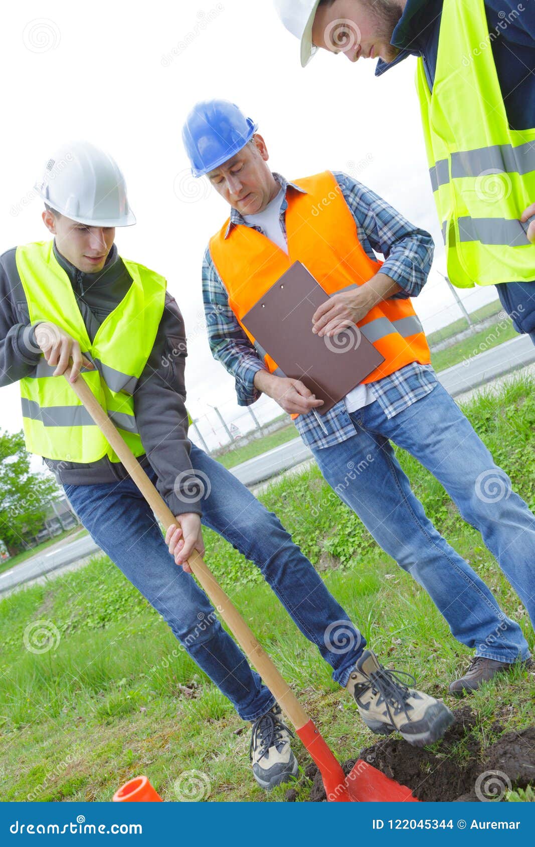 Builders at green field stock photo. Image of green 122045344