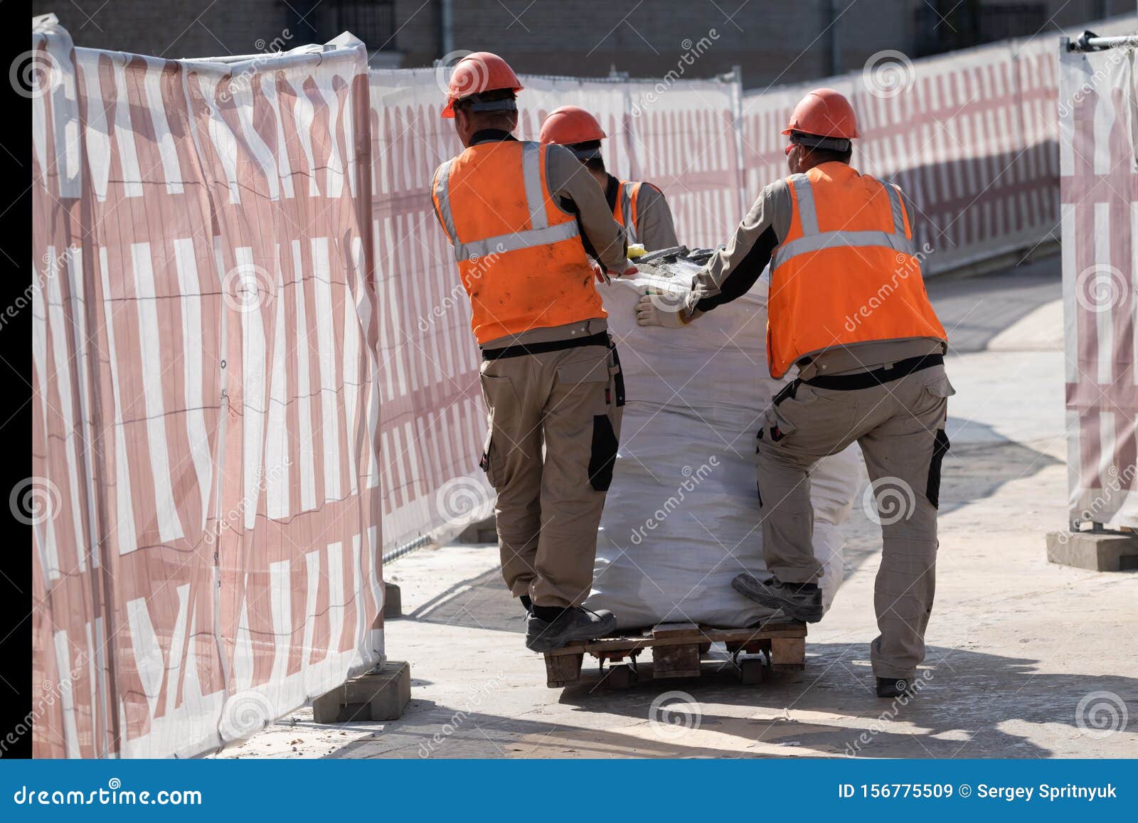 Builders Take Out Construction Waste in a Big Bag on a Loader Editorial