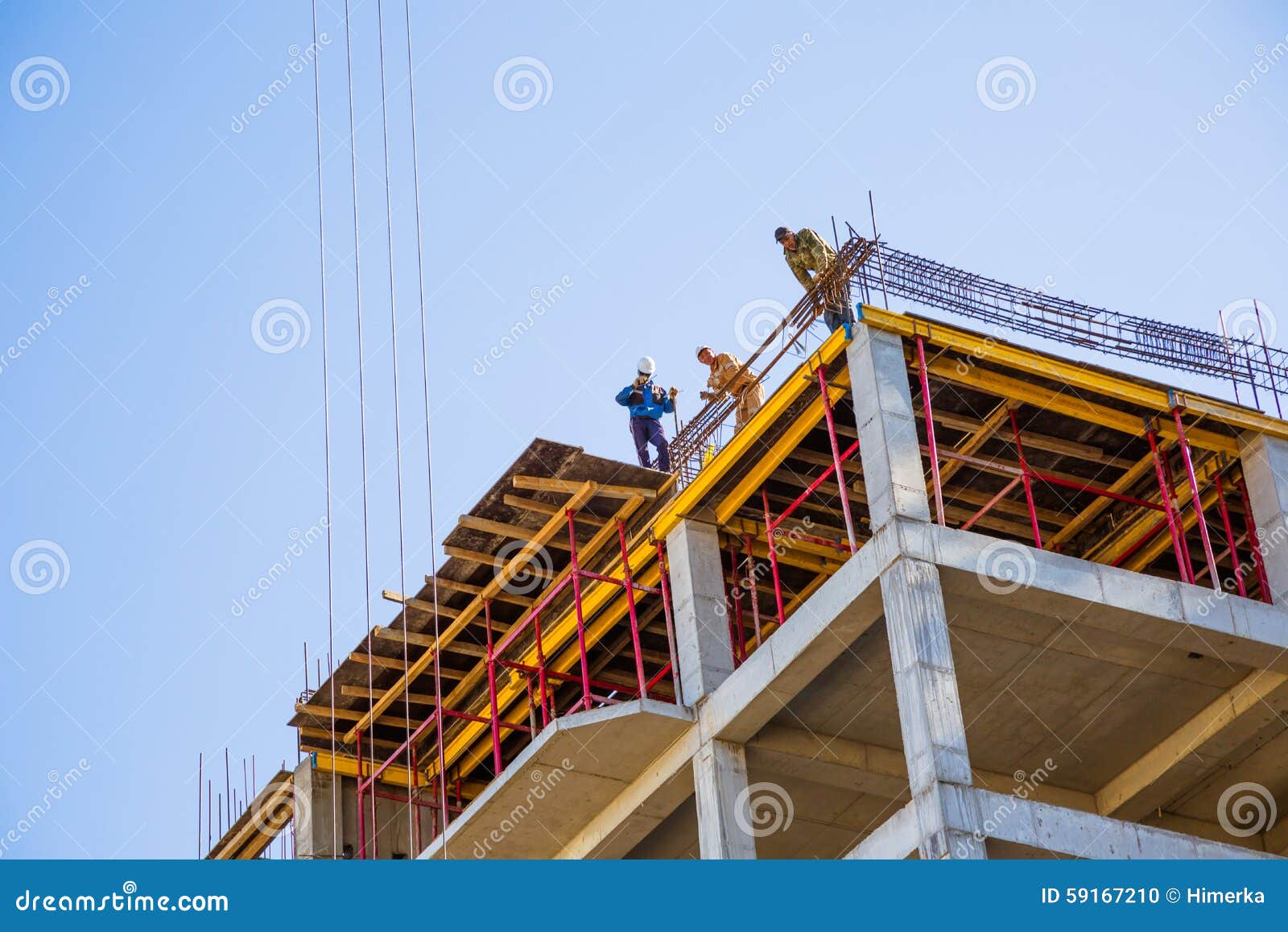 Builders on a top editorial image. Image of operator 59167210