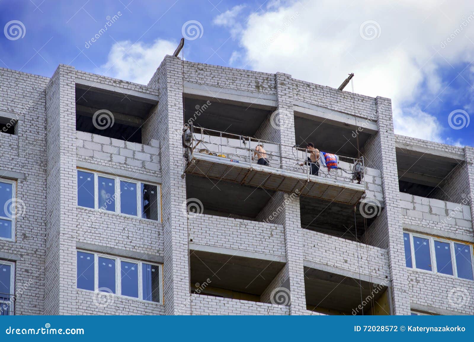 Builders Working on the Construction of the Brick House. Ukraine