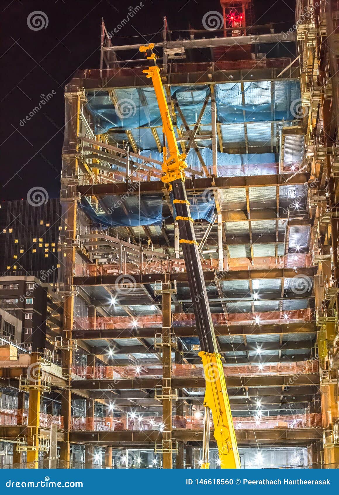 building construction site with crane at night time - sendai, miyagi, japan