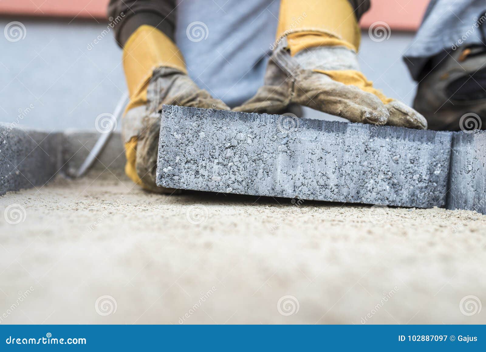 Building Contractor Laying A Paving Slab Stock Image Image Of