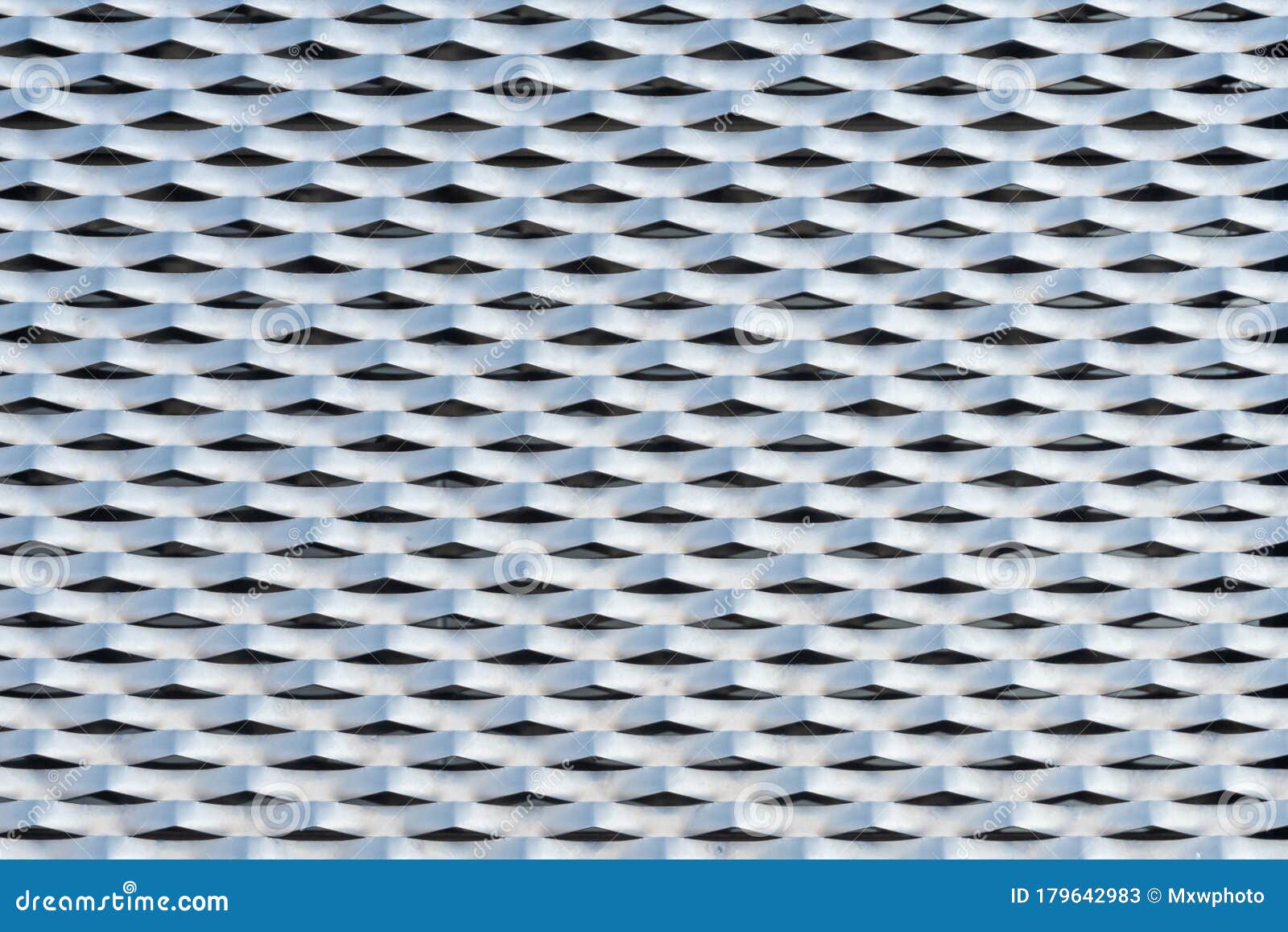 Building Facade Cladded with Punched and Perforated Metal Plates