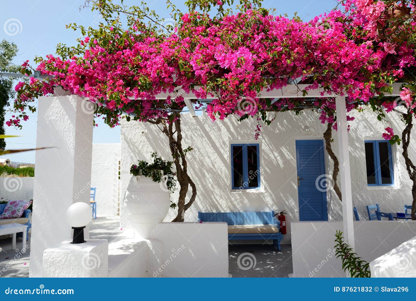 Building of Hotel in Traditional Greek Style with Bougainvillea Stock ...