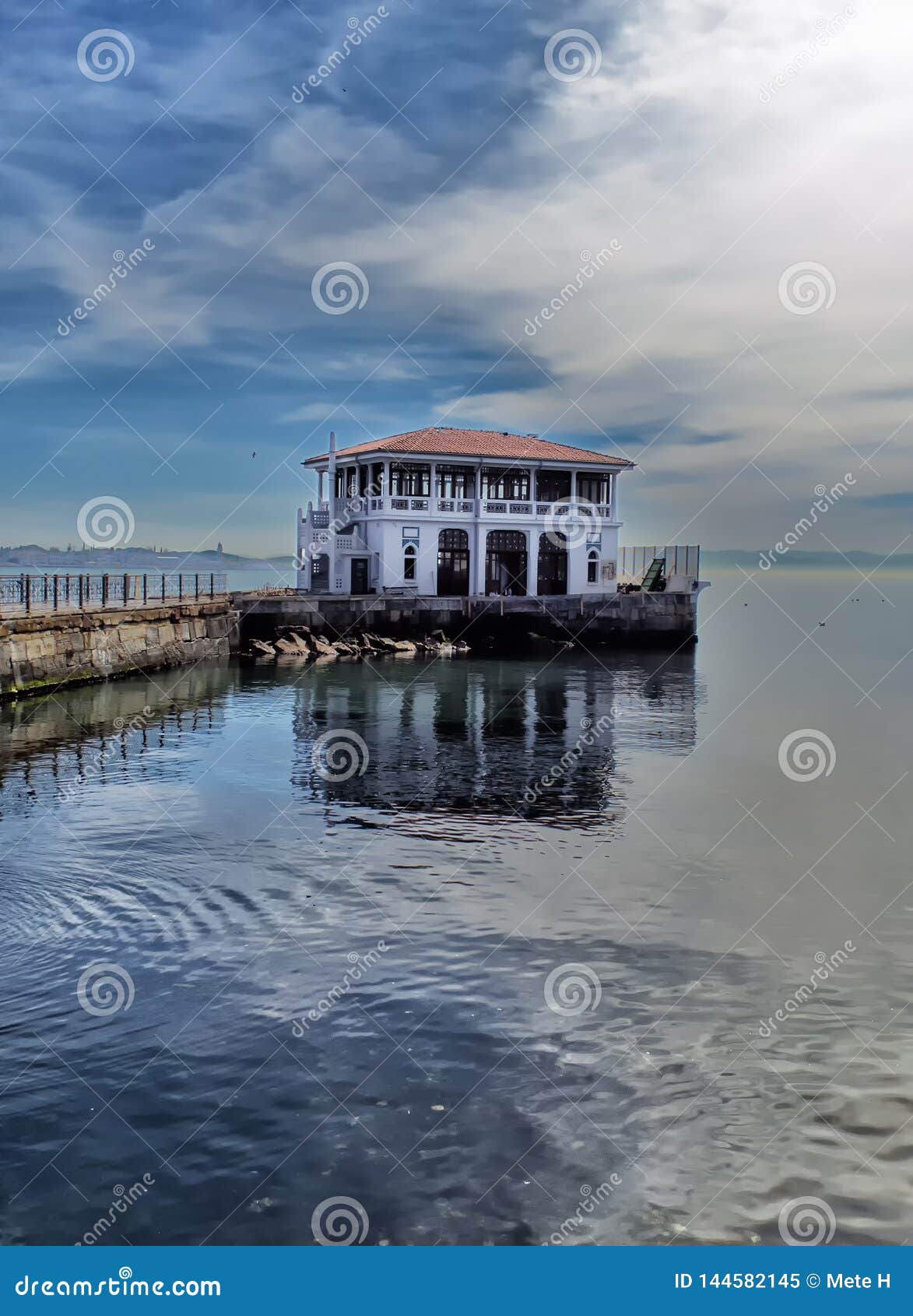 the building of a port for ships for city transport in istanula in a part of the city called moda and its reflections on the surfa
