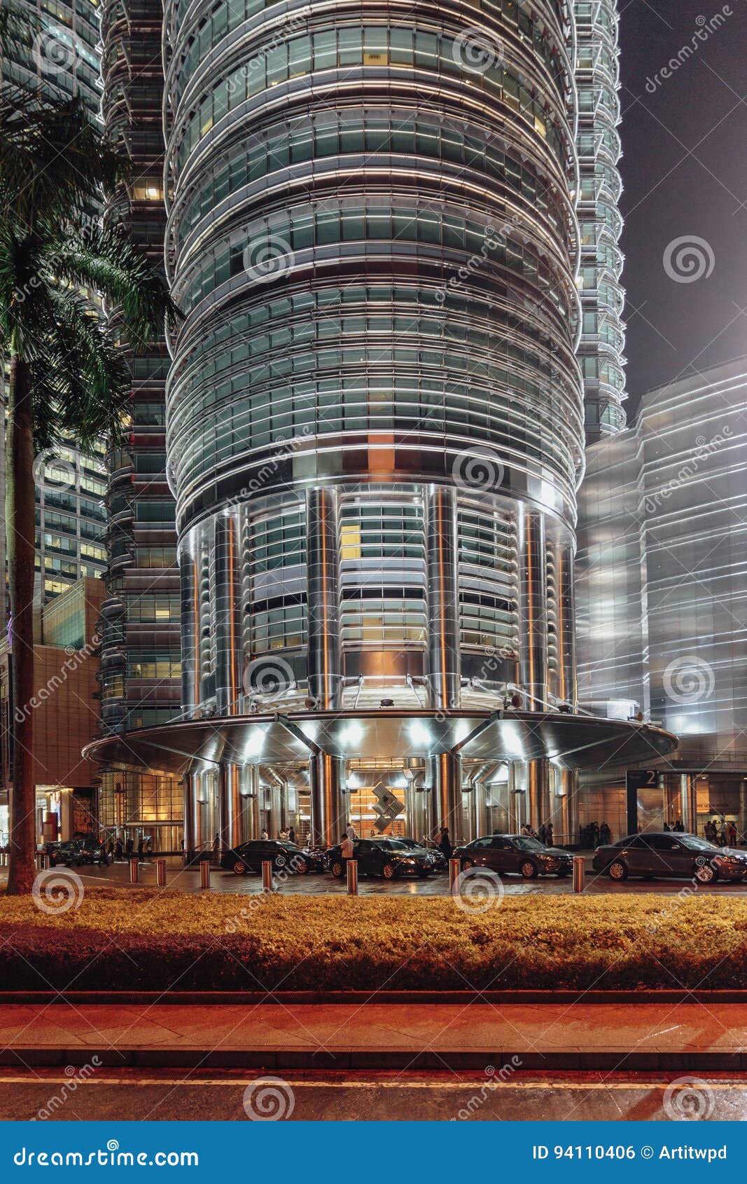 Building Skin On Ground Floor Of Twin Towers At Night In Kuala