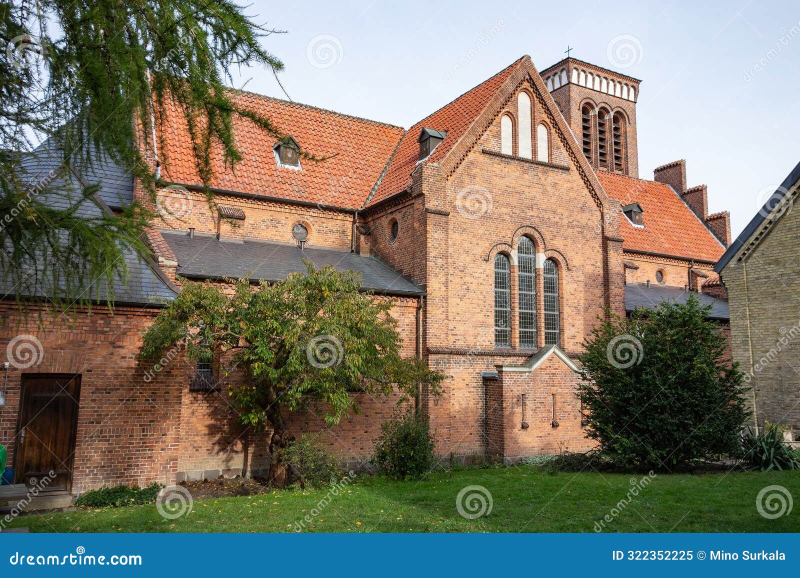 building and tower of sankt laurentii church (sankt laurentii kirke) in roskilde, denmark