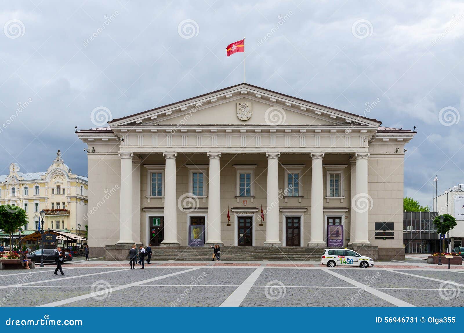 Building of Town Hall on Town Hall Square, Vilnius, Lithuania. VILNIUS, LITHUANIA - JULY 10, 2015: Unidentified tourists walk on Town Hall Square near Building of Town Hall