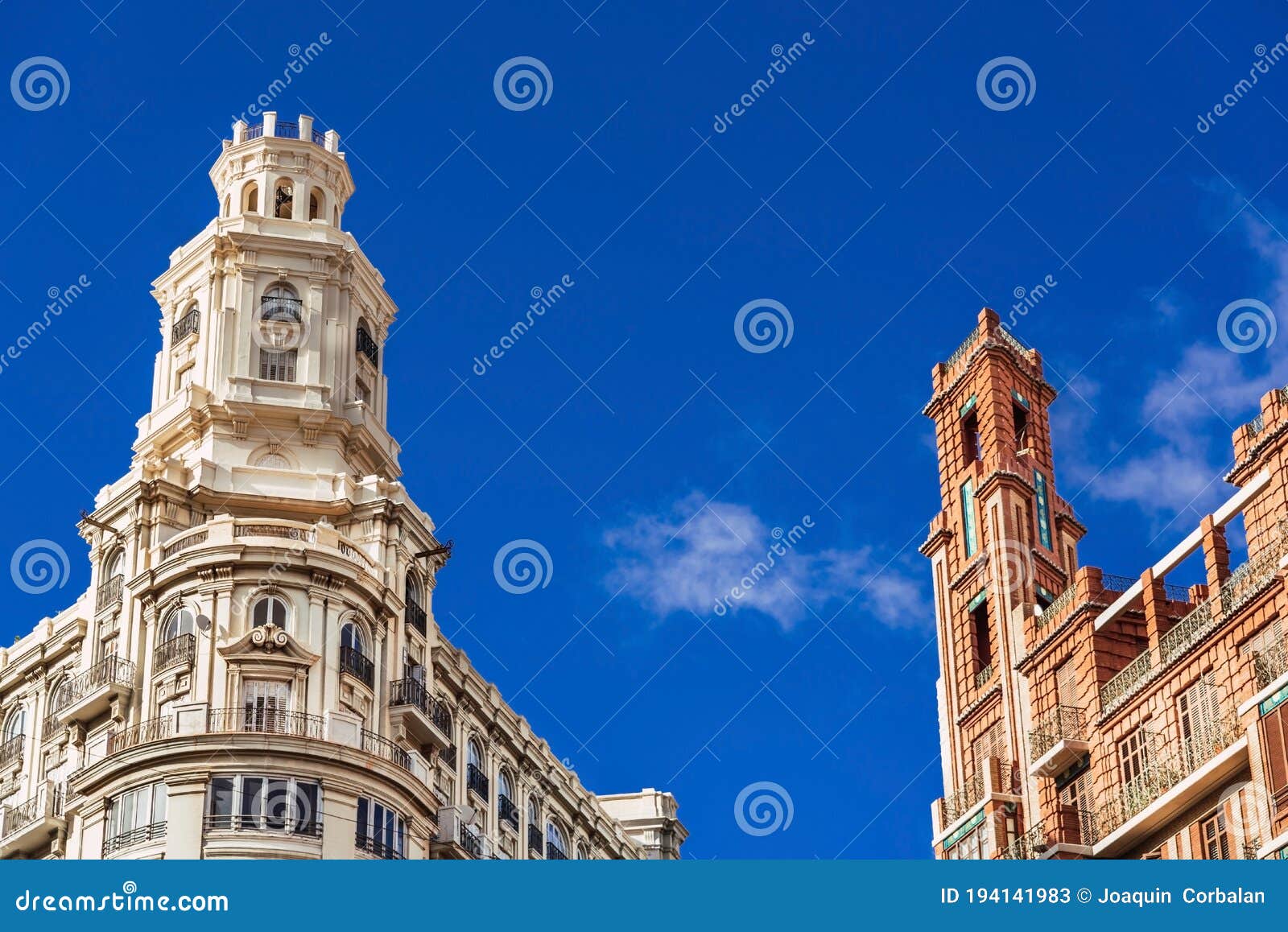 buildings with modernist style towers in the plaza del ayuntamiento in valencia