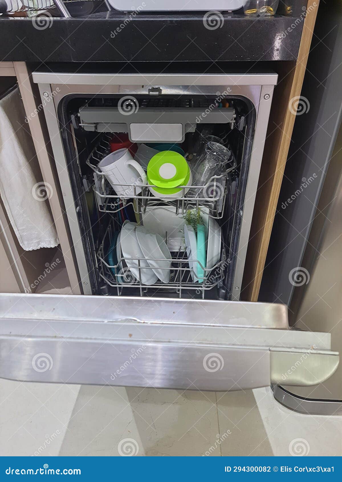 Builtin Dishwasher Open Door. Kitchen with Integrated Appliances Stock