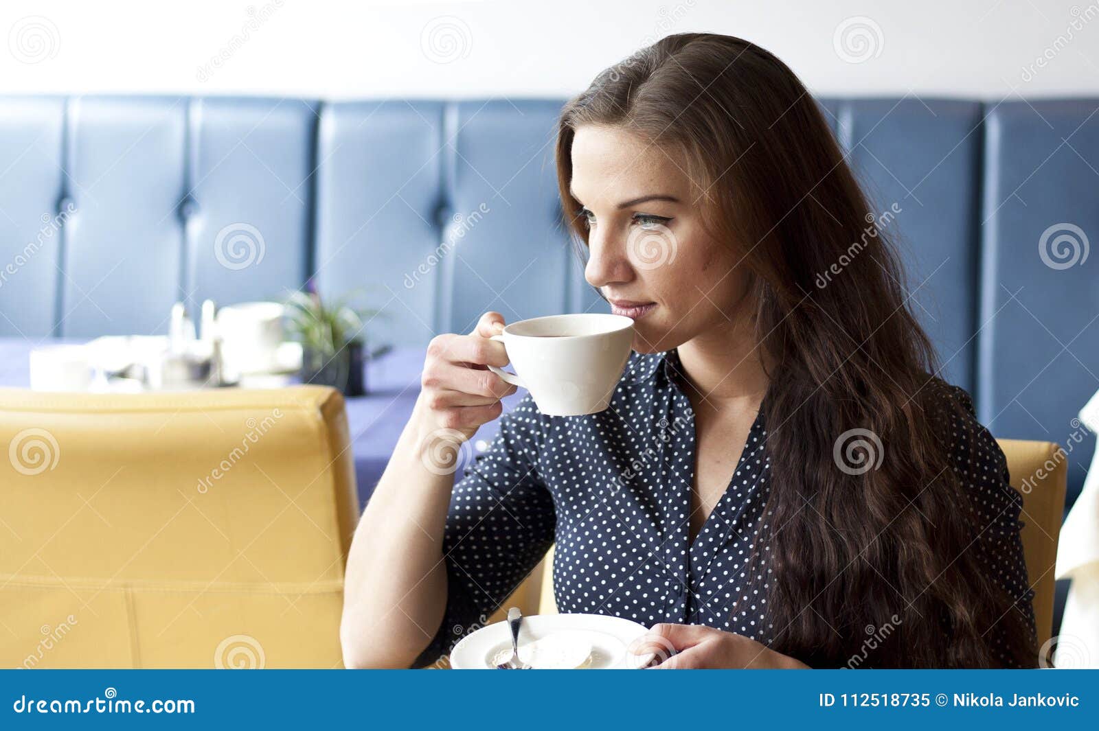 buisness woman drinking cofee in restaurant