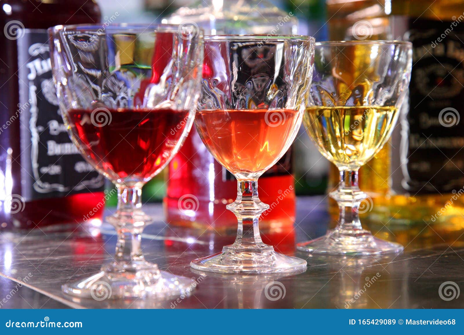 Tincture on a Bar Counter. Bulk and Tincture of Glasses on a Bar