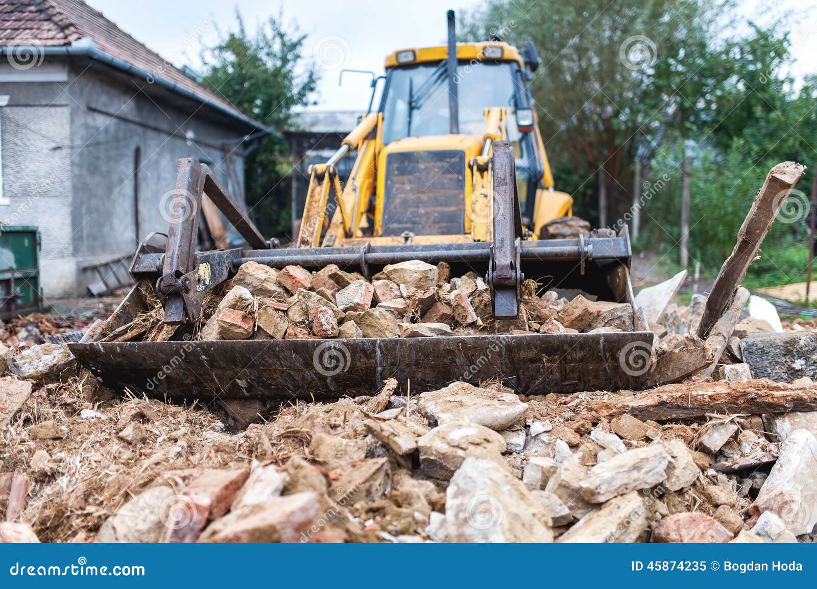 bulldozer demolishing an old building