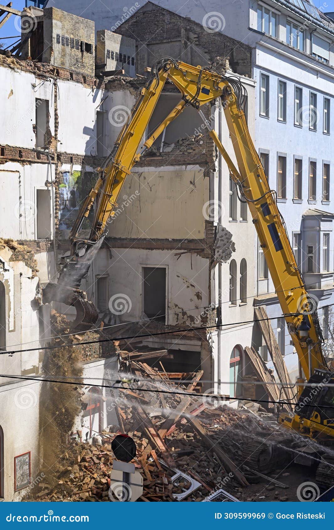 a bulldozer is demolishing an old building in vienna