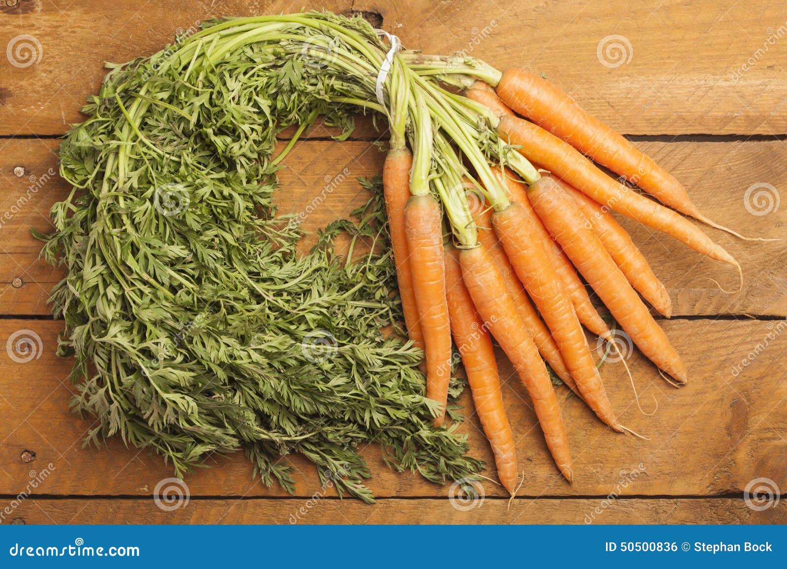 Bunch of carrots on wood stock photo. Image of healthy 50500836